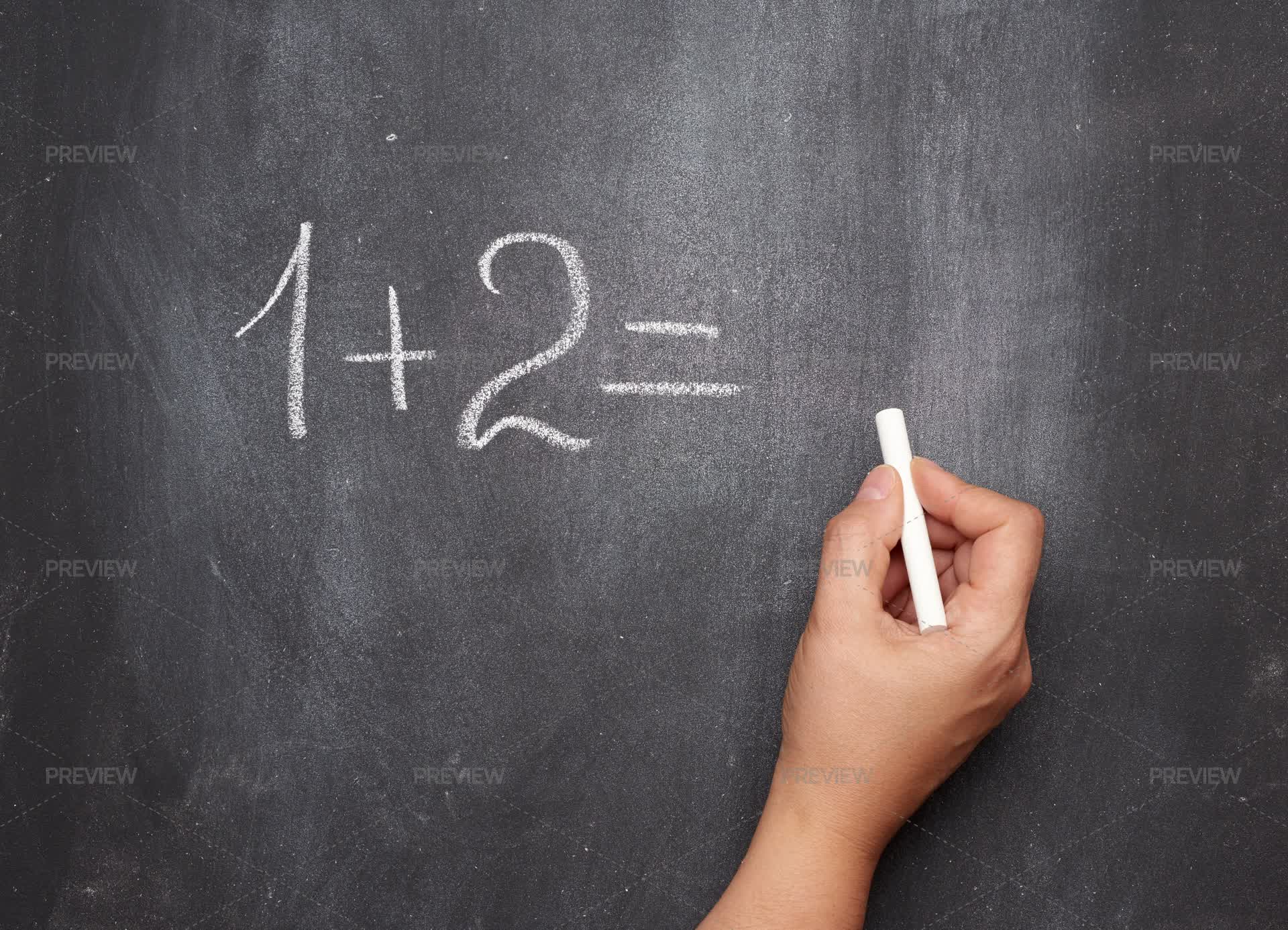 Writing A Math Problem With Chalk by ndanko - Stock Photos | Motion Array