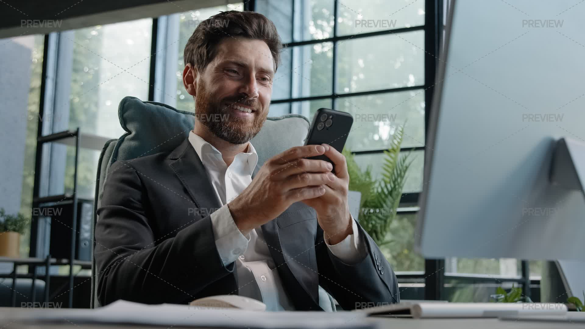 Businessman Uses Cell Phone At Office by MayaLab - Stock Photos ...