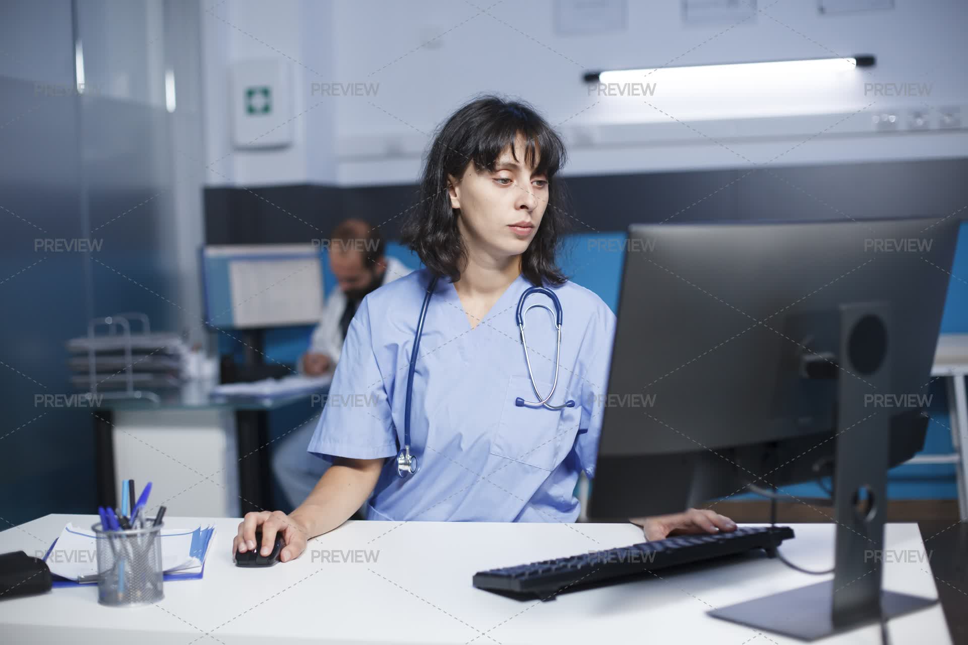 Open Medical File Nurse Checking Medical Files On Desktop - Stock Photos | Motion Array