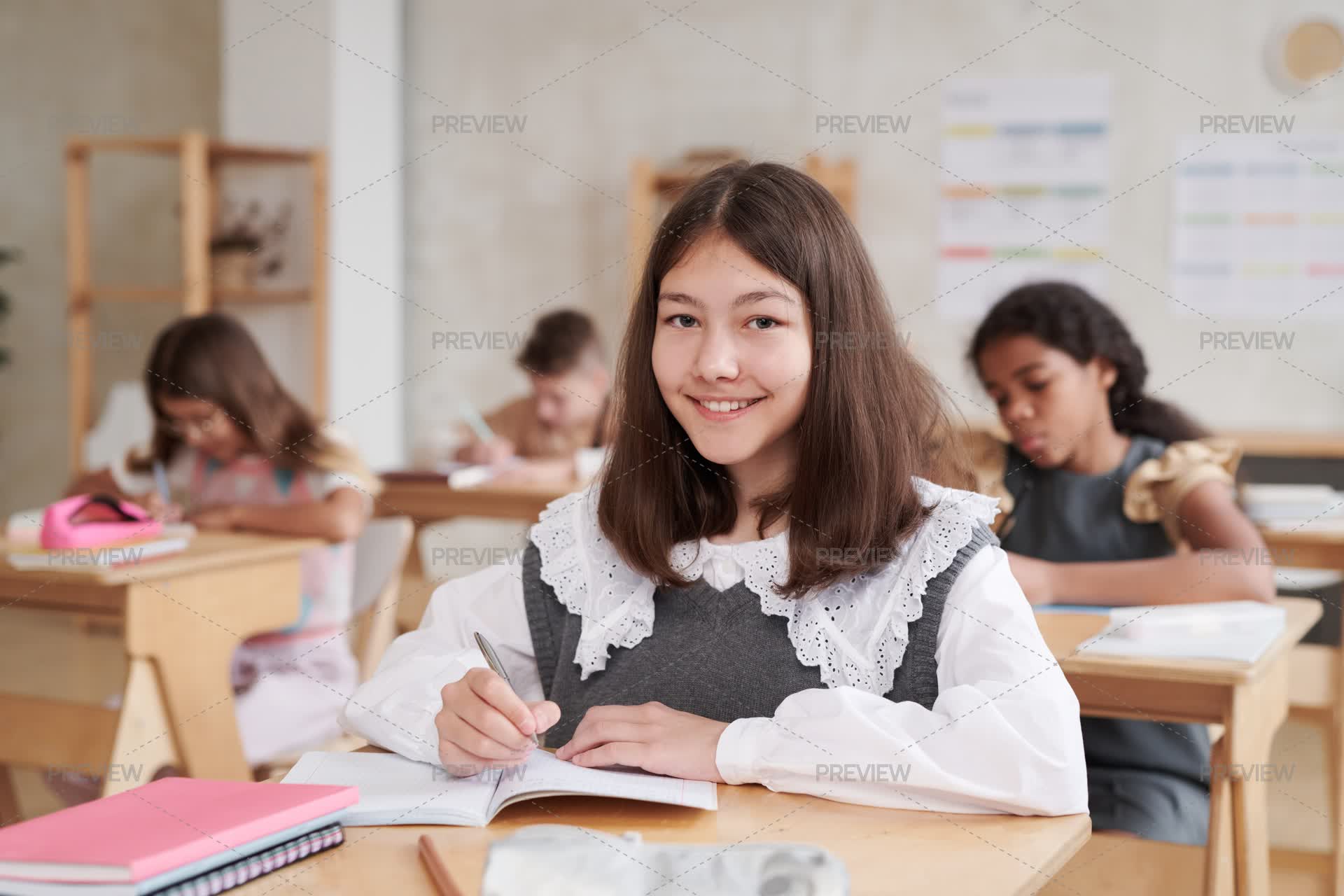 Good Looking Inclass Smiling Girl In Class - Stock Photos | Motion Array