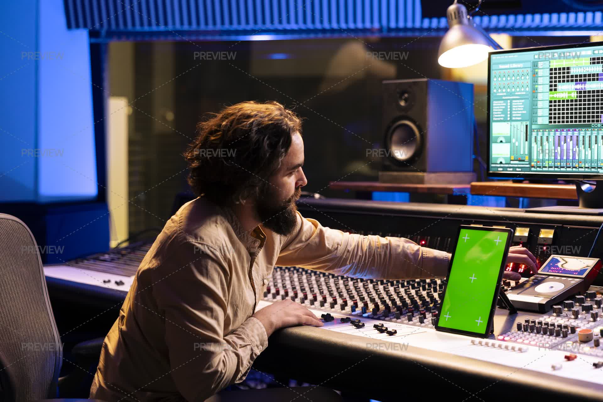 Sound Engineer Buttons Young Audio Engineer Pressing Buttons On Mixing Console Next To Green ...