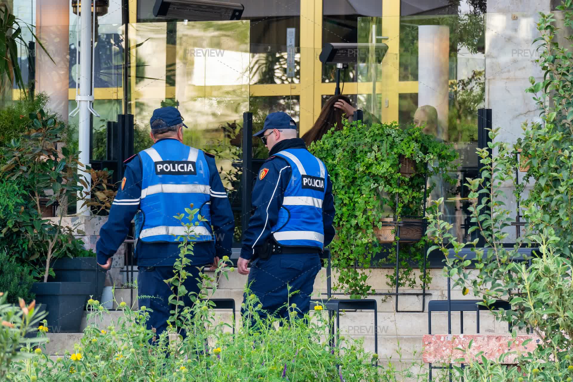 Two Police Officers Patrolling On A Front Of Opera At Skanderbeg Square ...