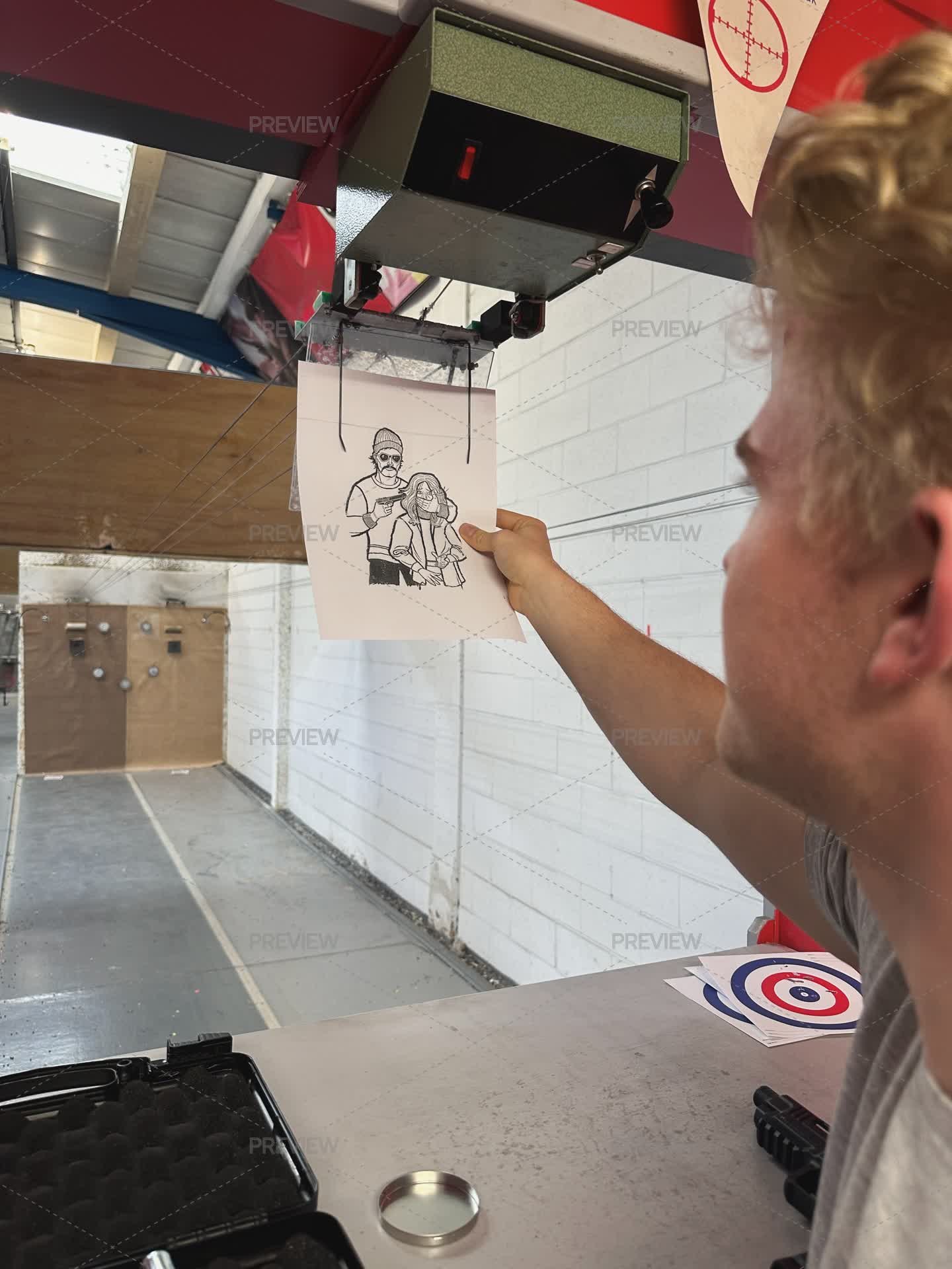 Full Person Rear View Target Rear View Shot Of A Man Putting A Shooting Target Up - Stock Photos ...