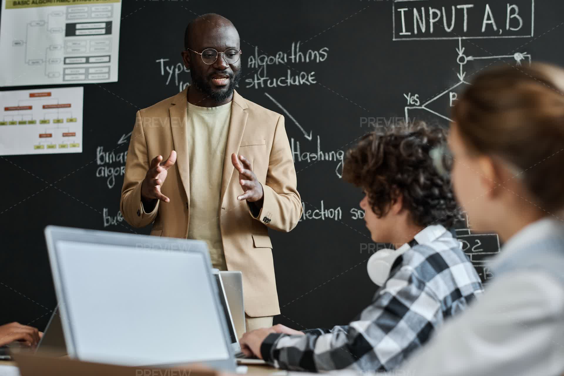 Teacher Explaining The Work Of Computer System - Stock Photos | Motion ...