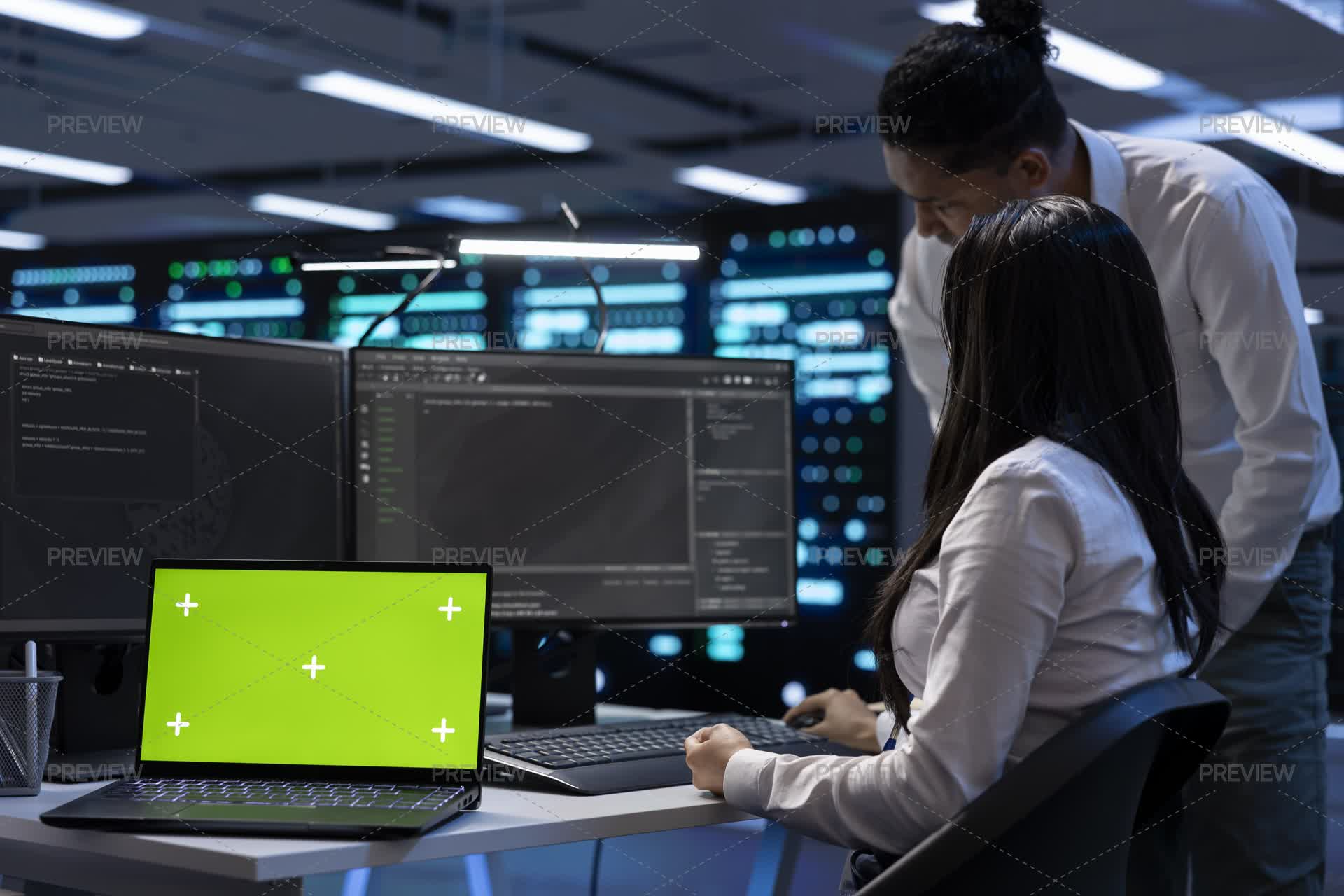 Chroma Key Notebook In Front Of Engineers Fixing Server Racks Rows by ...