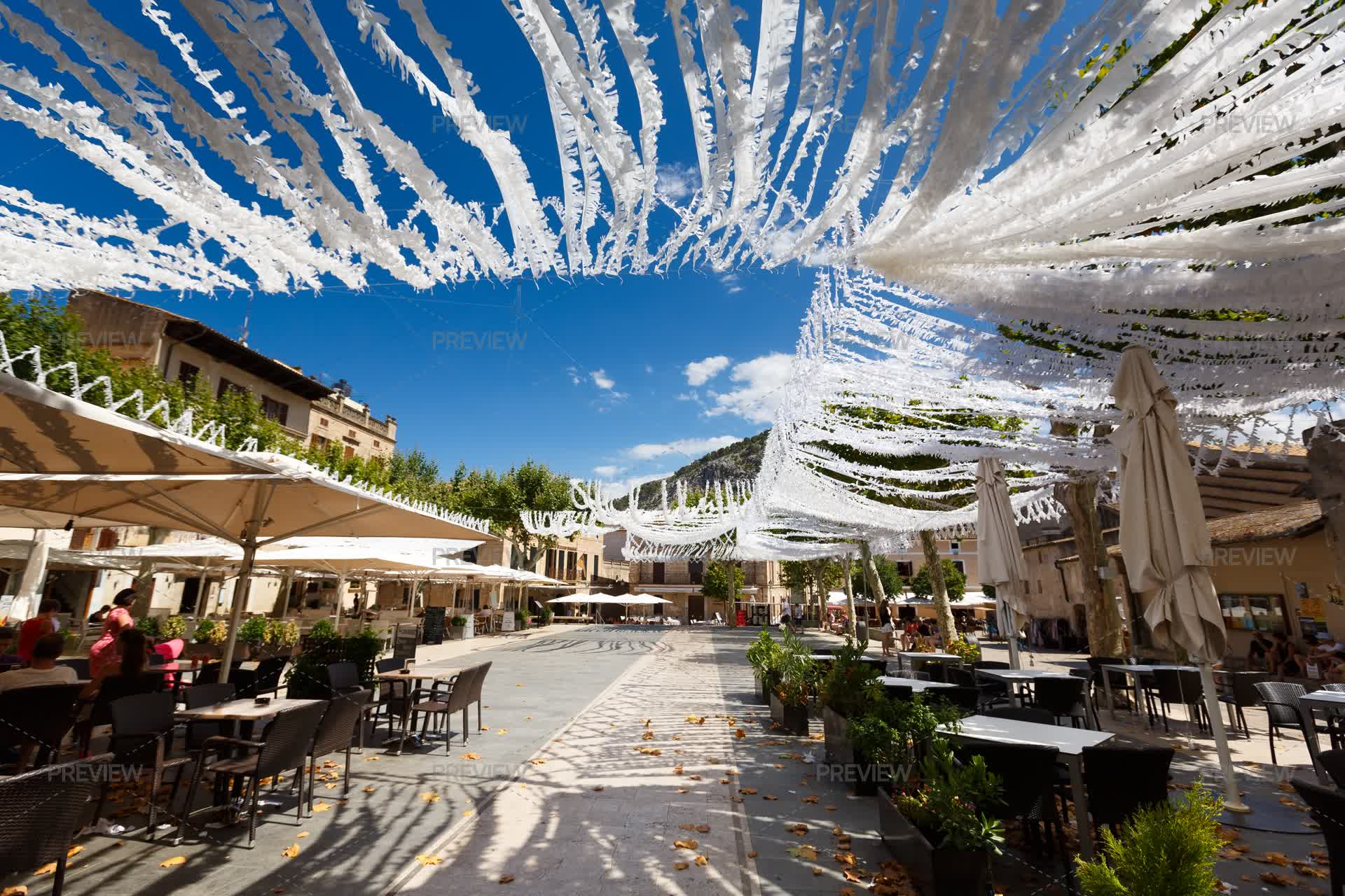 Pollenca Square Autumn Leaves Falling In Pollenca's Main Square by castenoid - Stock ...