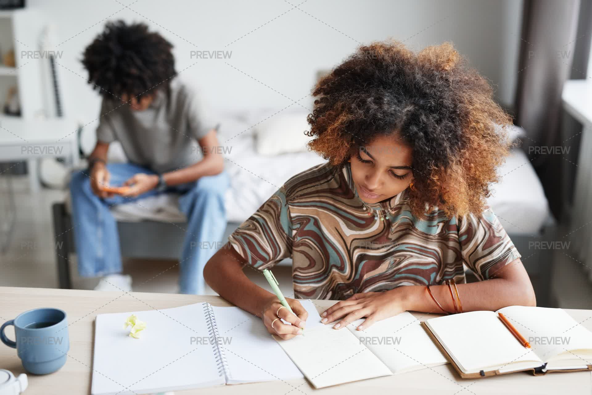 Girl Writing Assignment Teenage Girl Doing Written Assignment by SeventyFour - Stock Photos ...