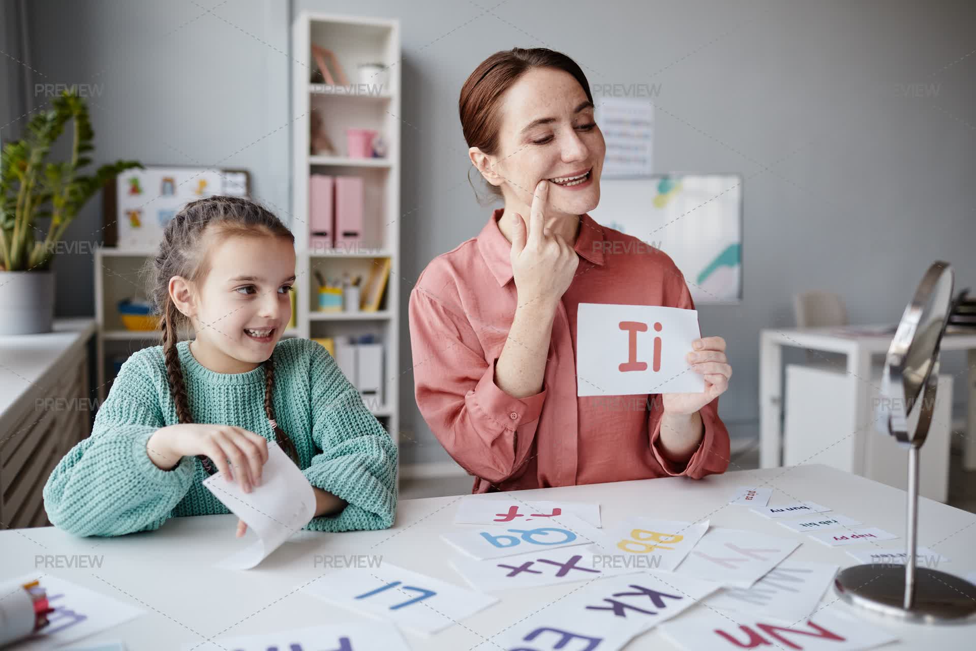 Teacher Teaches Children To Read Letters Correctly - Stock Photos ...