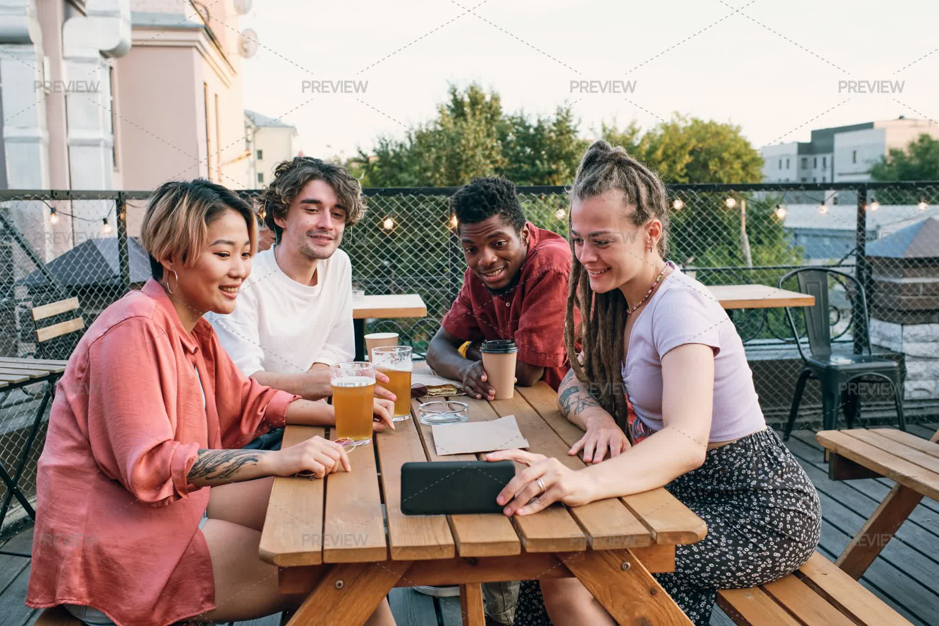 Chat Multicultural Happy Multicultural Friends Talking On Video Call In Outdoor Cafe by ...