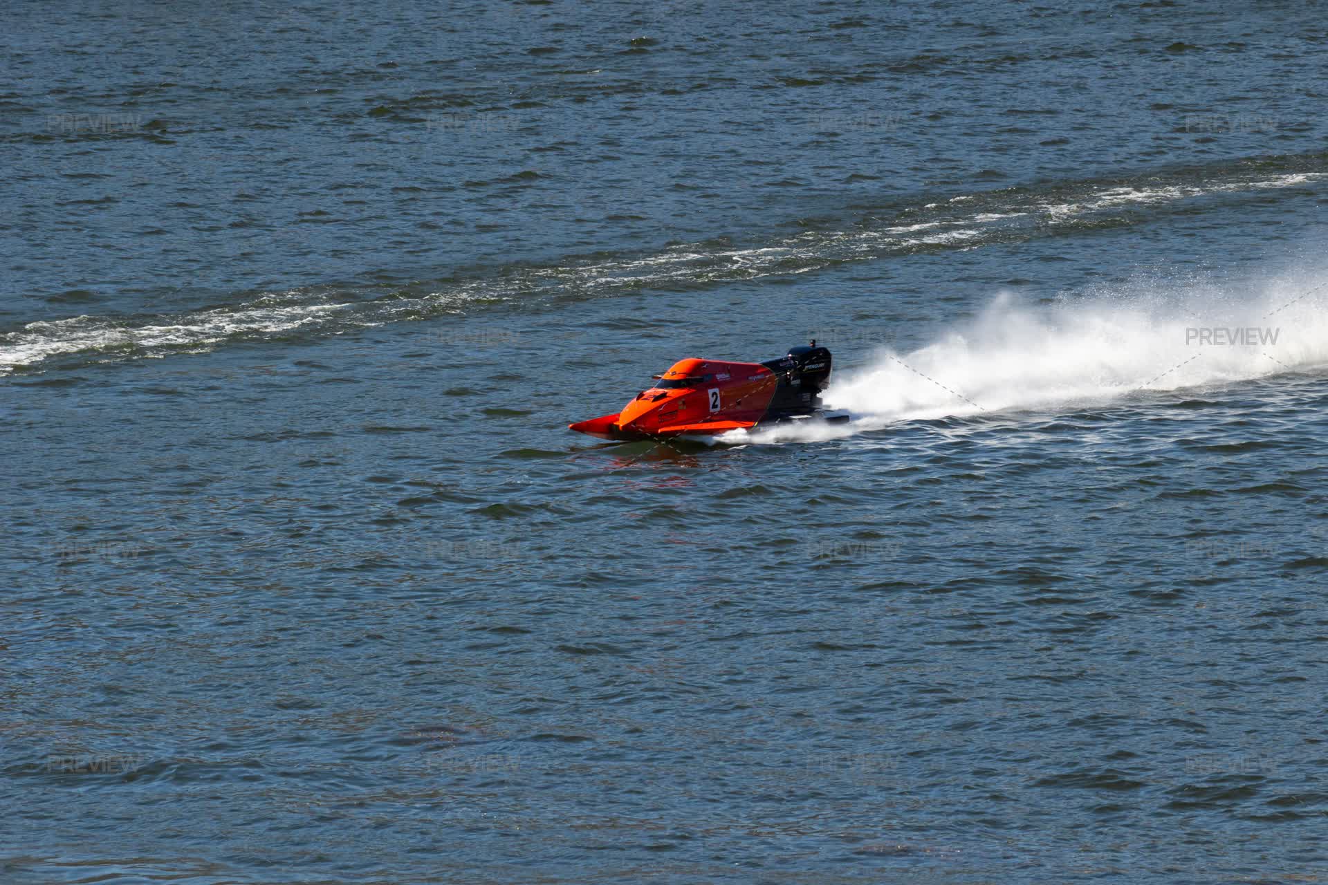 Red Powerboat Racing Red Powerboat Goes Fast With Splashes Of Water During Race. F2 ...