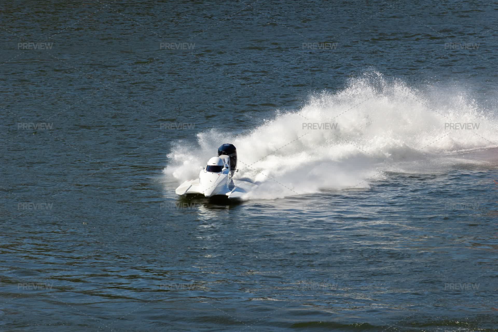 White Speedboat Making Turn With Splashes Of Water During Racing ...