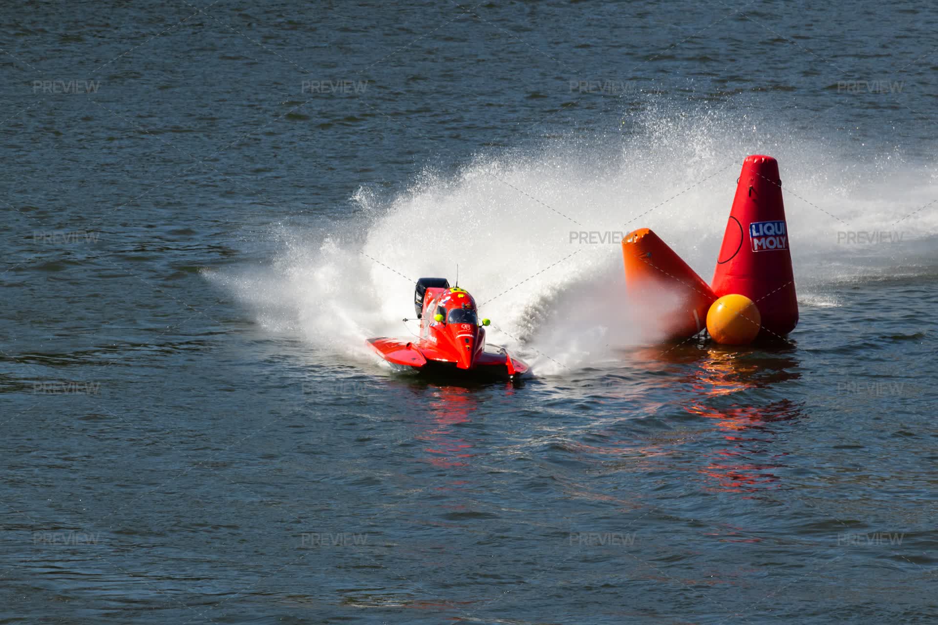 Red Powerboat Makes Sharp Turn With Splashes Of Water During Race. Red ...