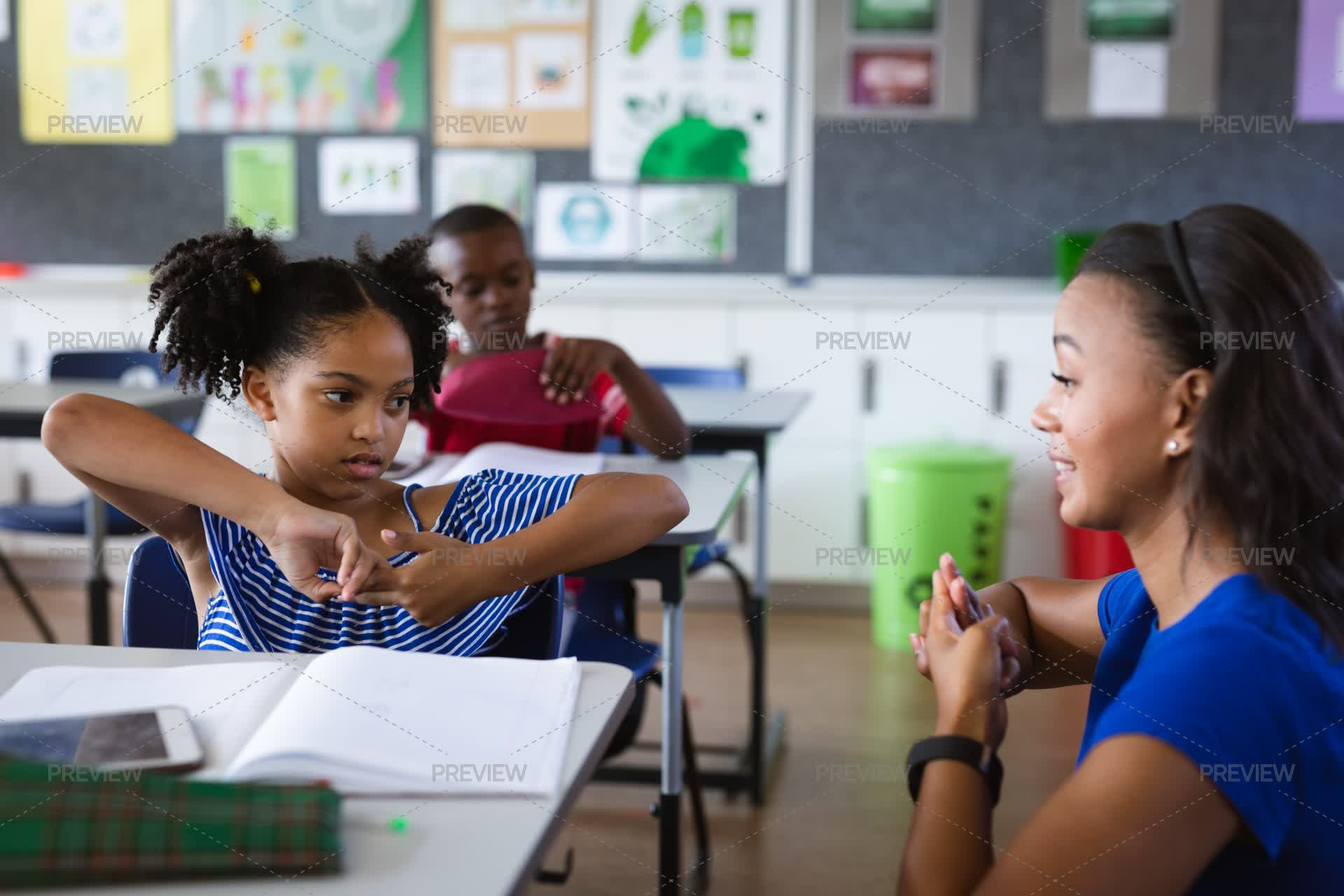 Teacher And Student Talking In Hand Sign Language by Wavebreak Media ...