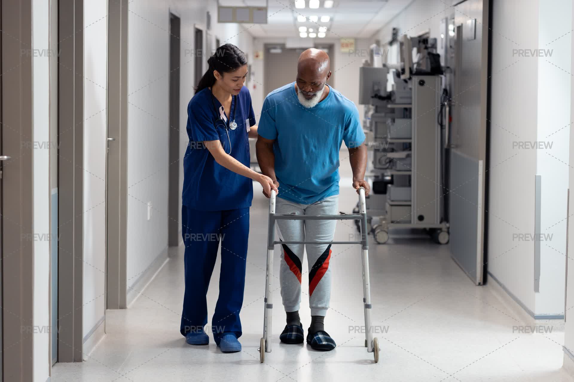 Snurse Using Walker Nurse Assisting Patient With Walker - Stock Photos | Motion Array