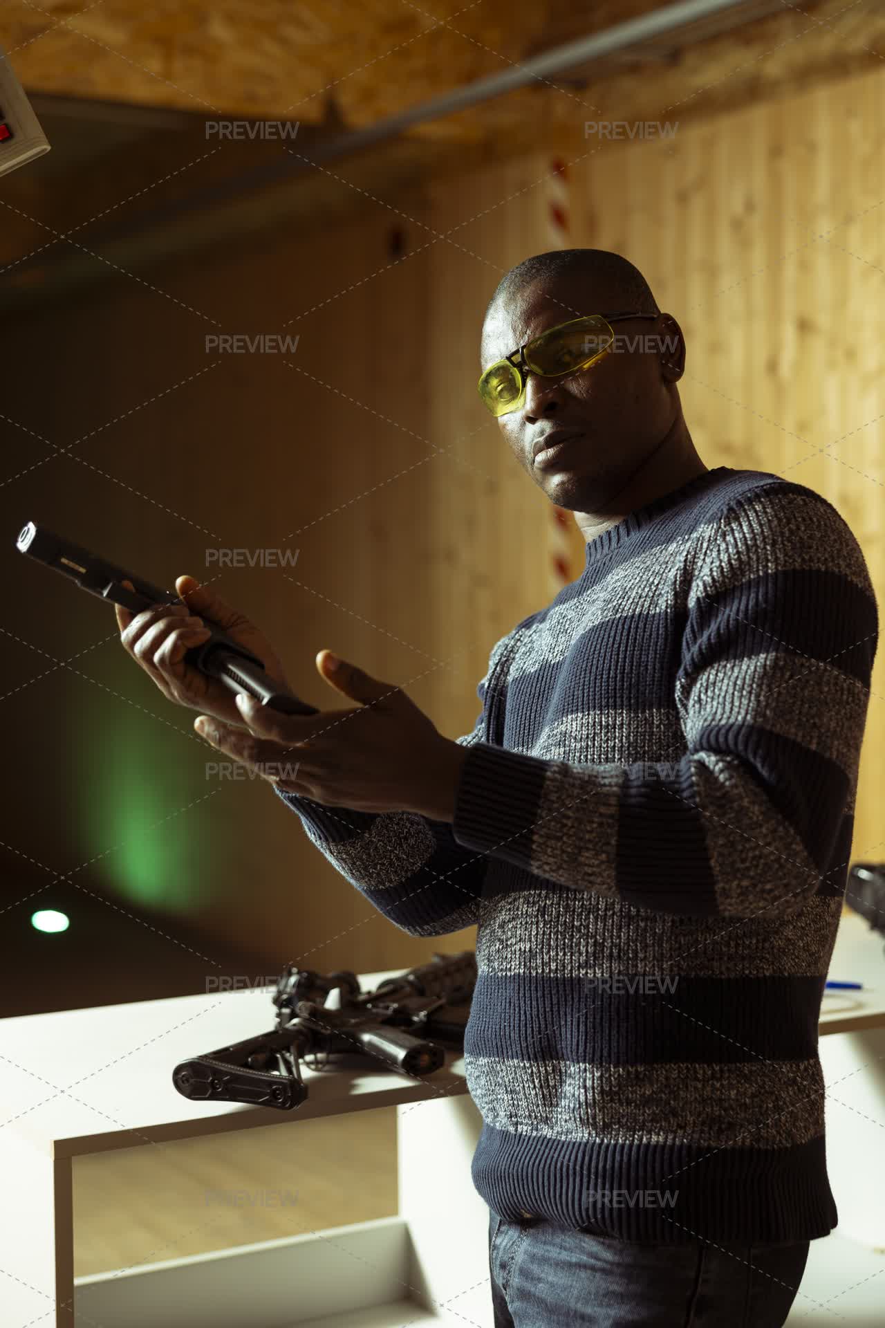 Portrait Of Shooting Range Client Reloading Handgun Magazine - Stock ...