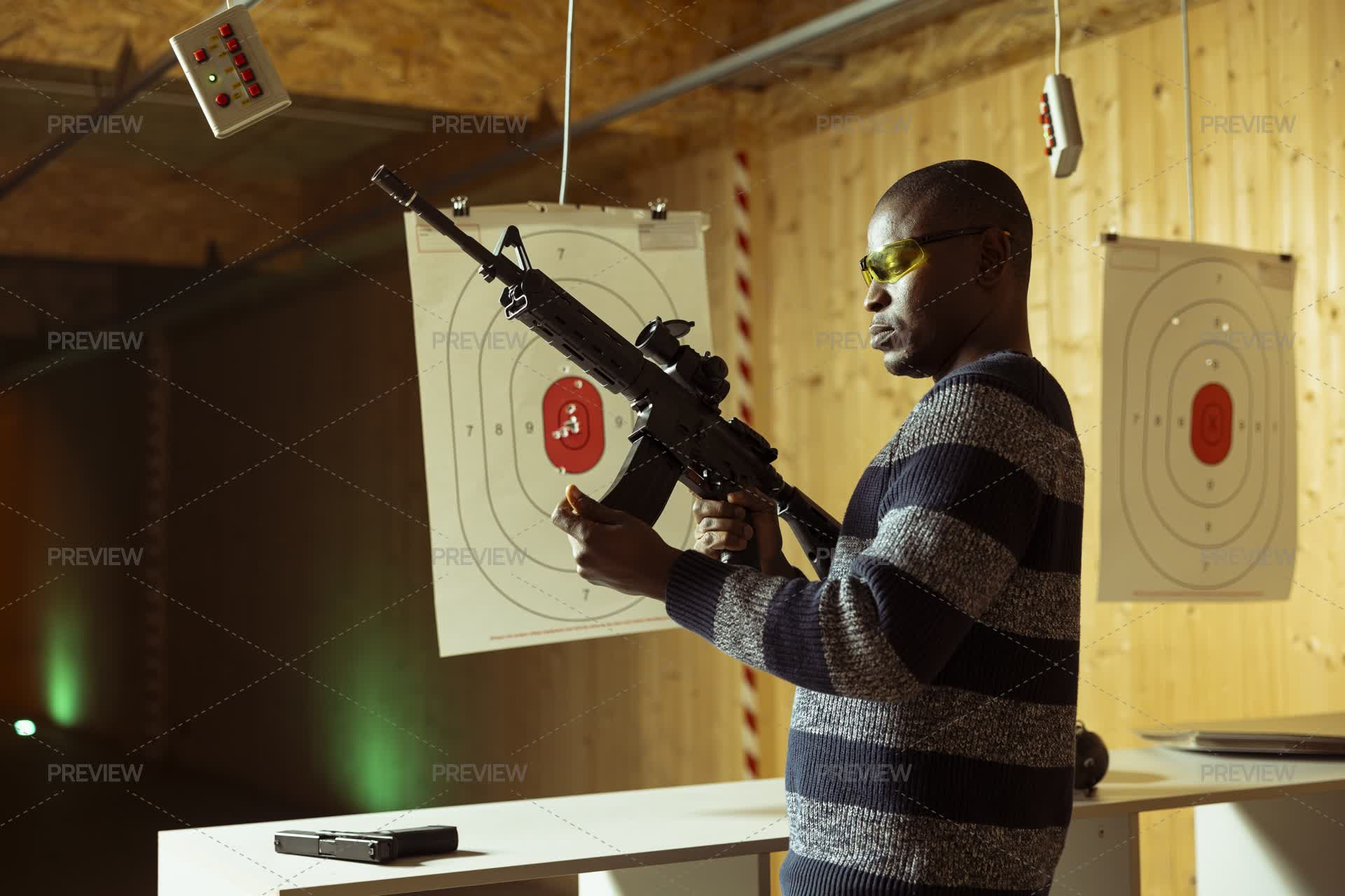 Well Rounded Rifle Man Pyro Man In Firing Range Practicing With Rifle, Reloading Magazine by ...