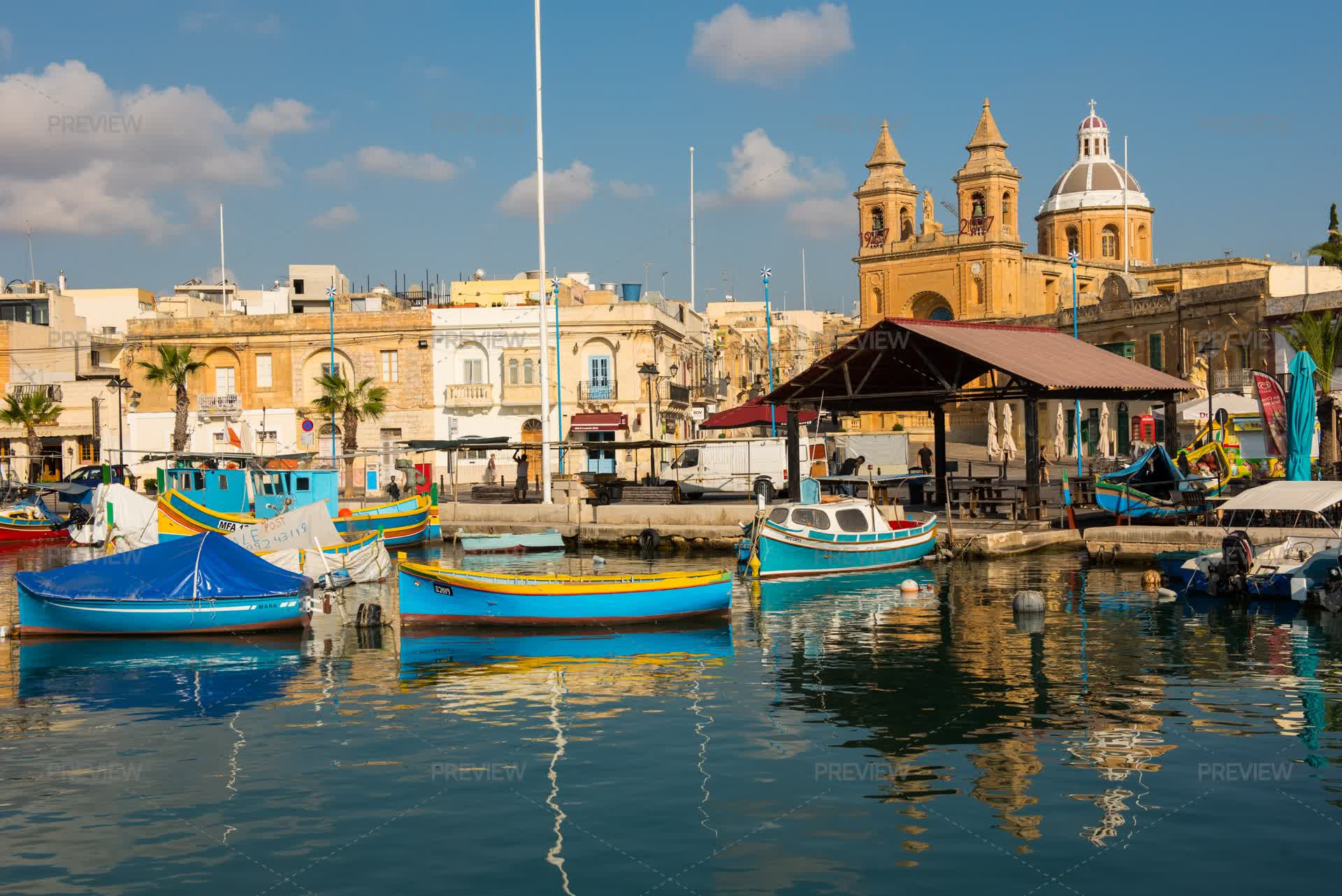 Marsaxlokk Fishing Village Harbor With Floating Boats And Vessels marsaxlokk-fishing-village-harbor-with-floating-boats-and-vessels