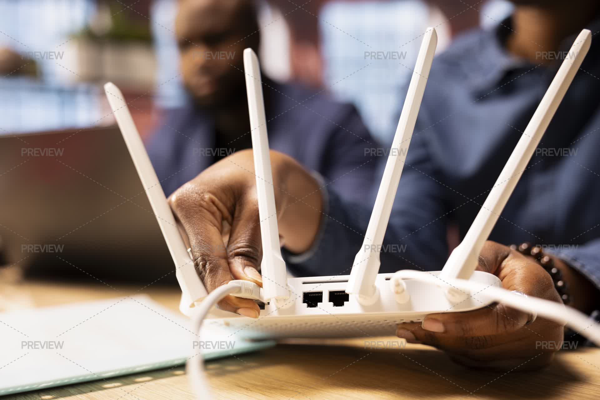 Woman Rebooting Their Wi-Fi Router Modem By Moving Cables - Stock ...