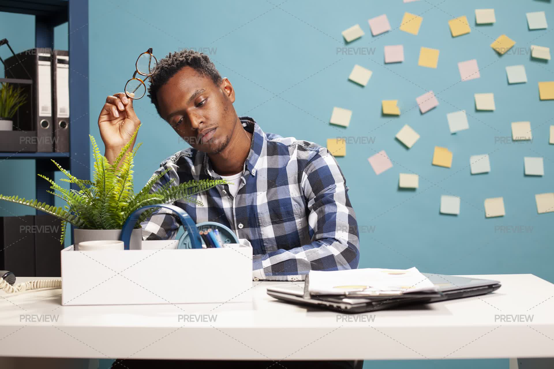 Worker Packing Up His Desk - Stock Photos | Motion Array
