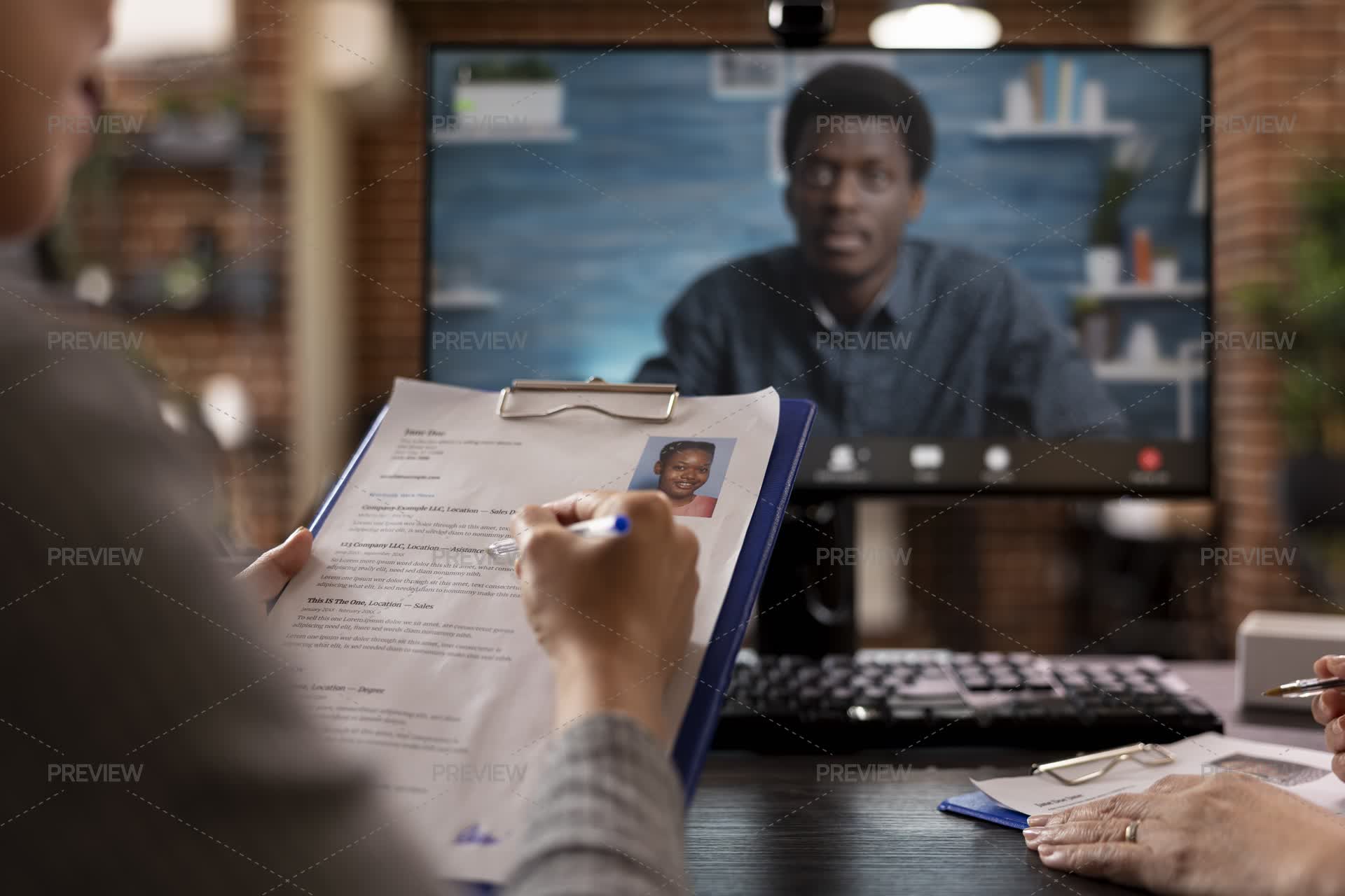 HR Staff Checking CV Of Applicant During Video Call - Stock Photos ...