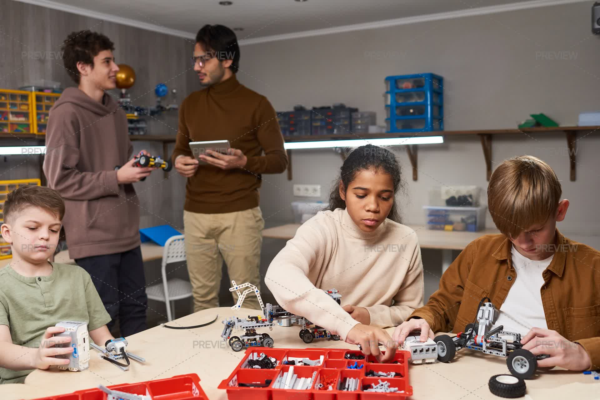 Robots For A Science Lesson Group Of Students Making Robots In A Science Lesson - Stock Photos ...