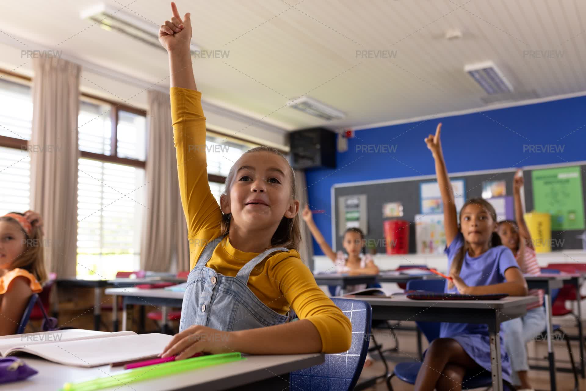 Children Raising Hands In Classroom by Wavebreak Media - Stock Photos ...