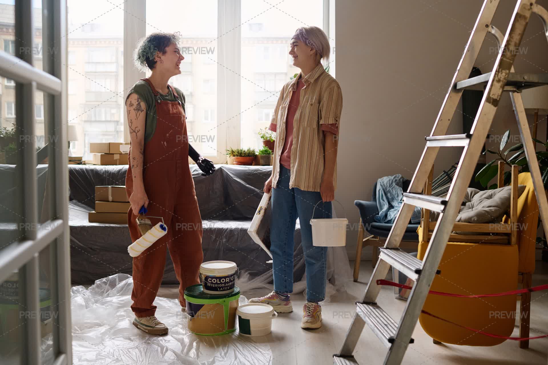 Repaired Fun Women Having Fun During Repair Of Apartment - Stock Photos | Motion Array