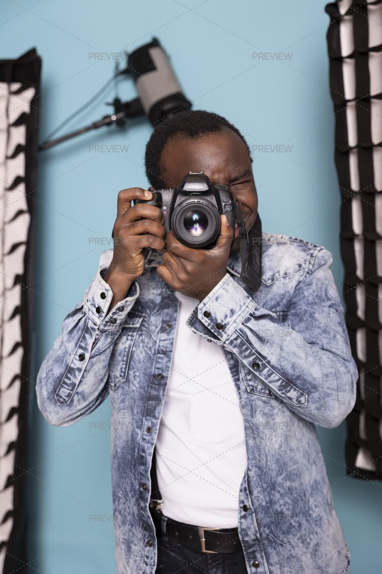 Man Demonstrating Example Man Demonstrating His Photography Skills - Stock Photos | Motion Array