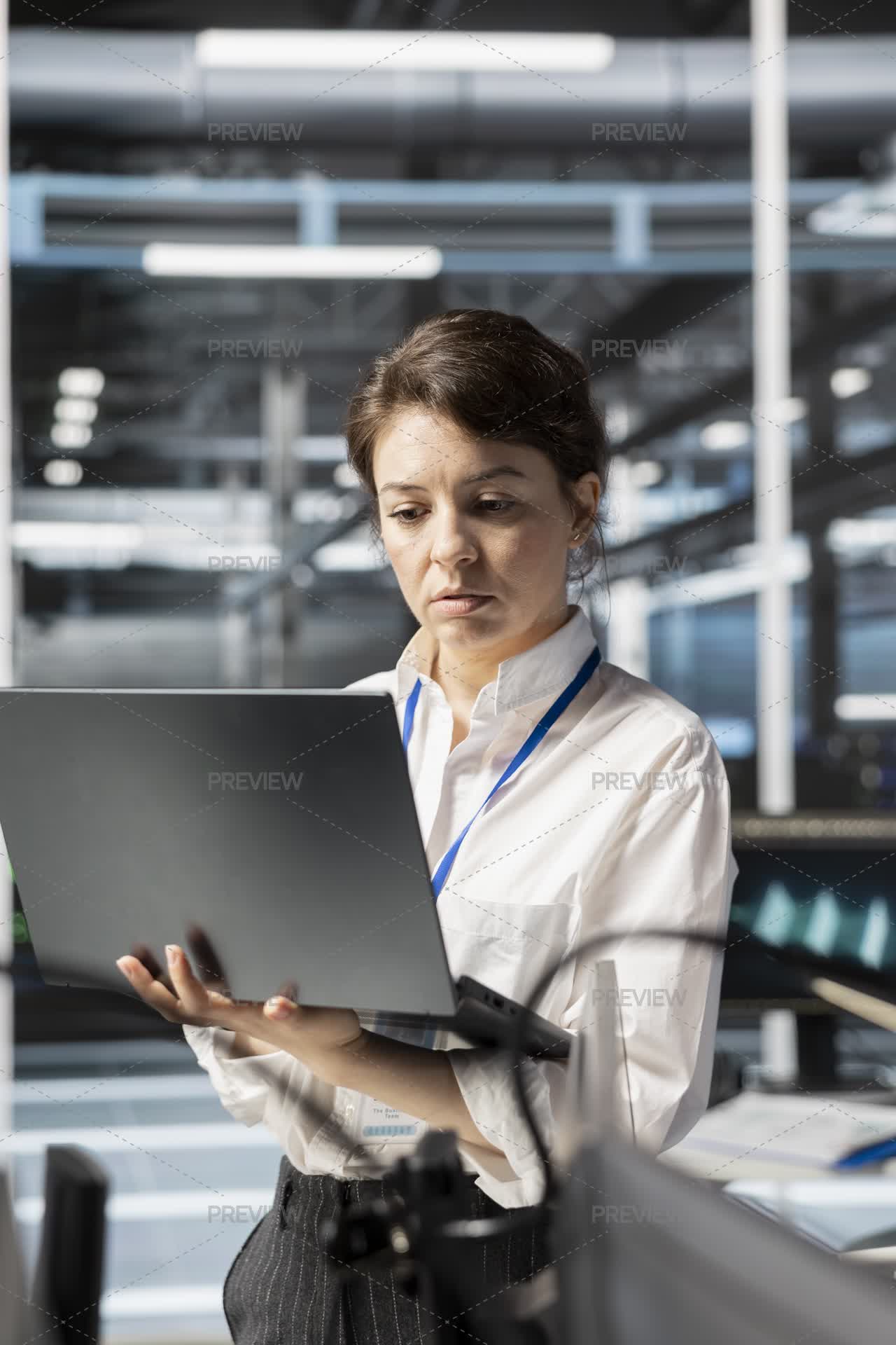 Updates Engineer Data Center Engineer Doing Software Updates On Laptop by DCStudio ...