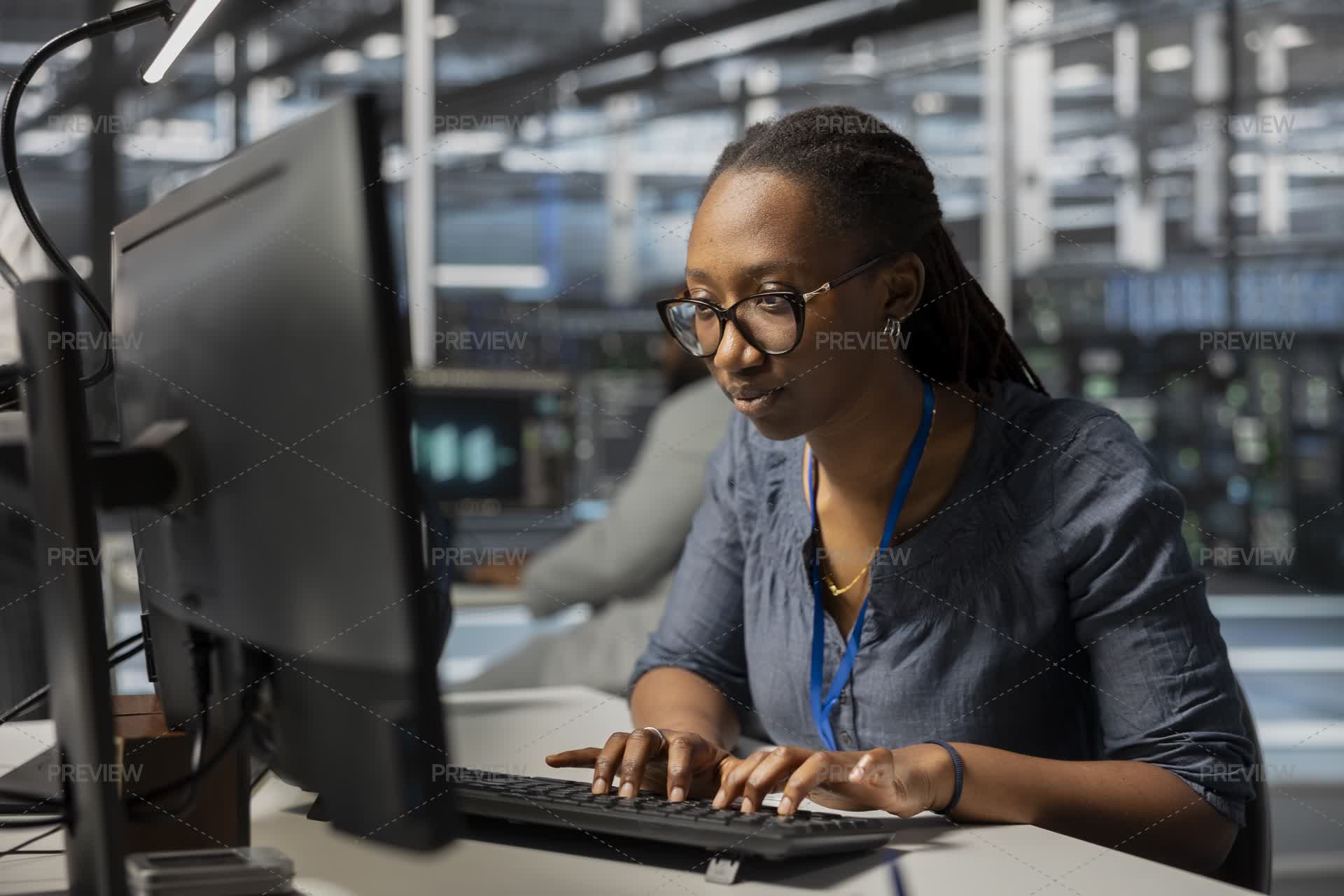 Employee Using PC To Oversee Data Center Equipment by DCStudio - Stock ...