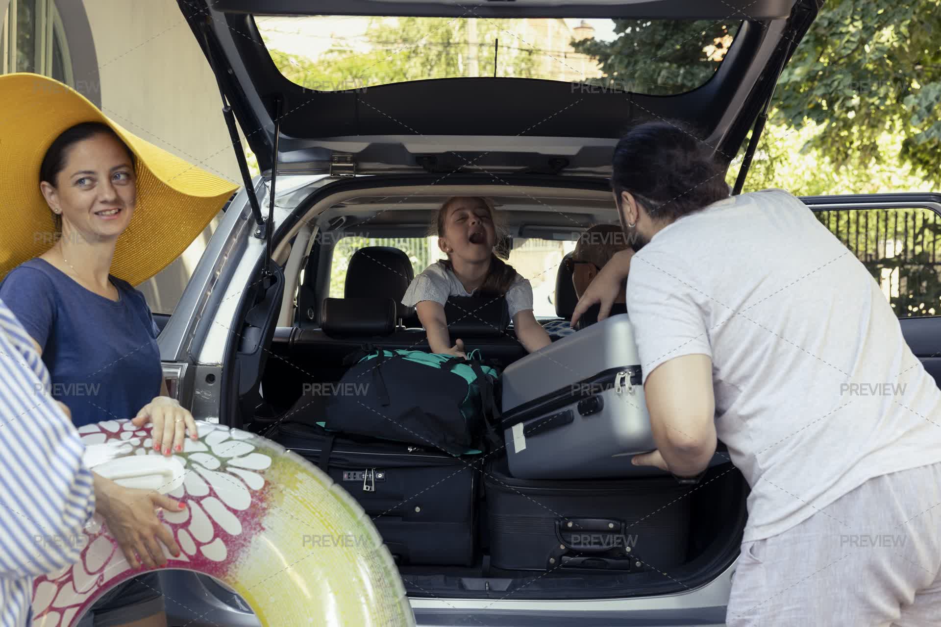 Multi Generational Family Shares A Cheerful Car Packing Activity Before ...