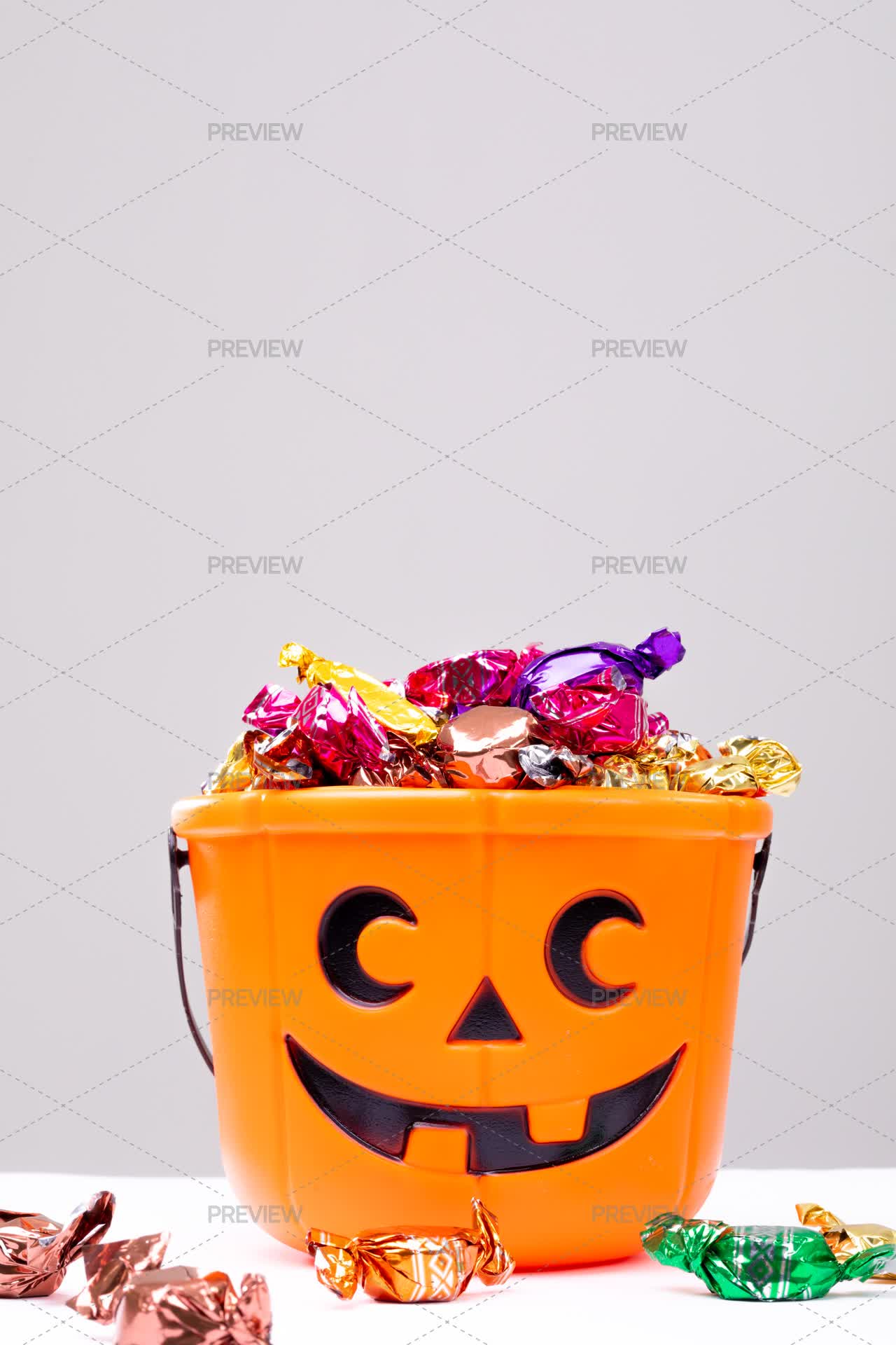 Halloween Candy In Pumpkin Bucket - Stock Photos | Motion Array