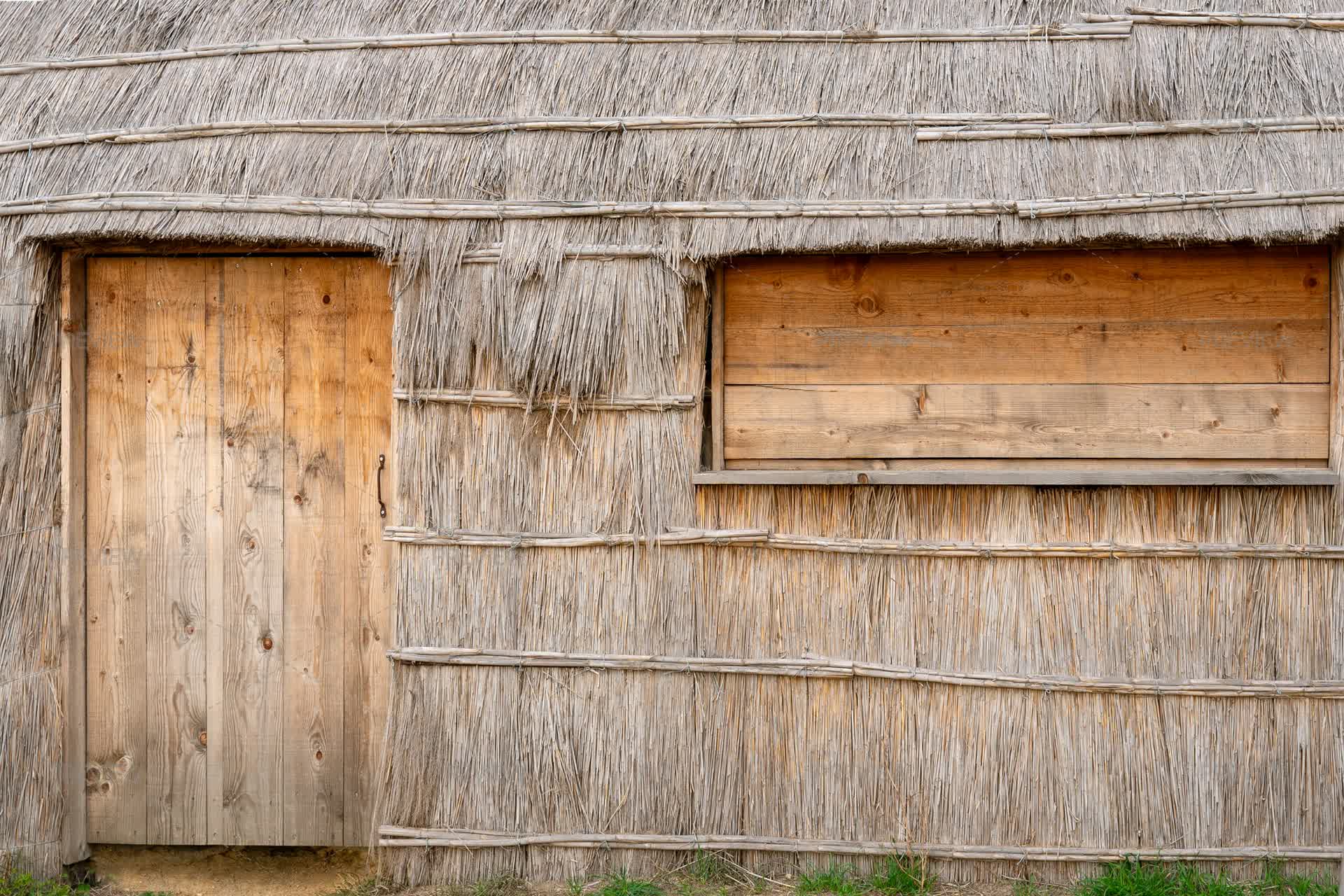 Close-up Of A Traditional Reed Hut Wall With Wooden Door And Window ...