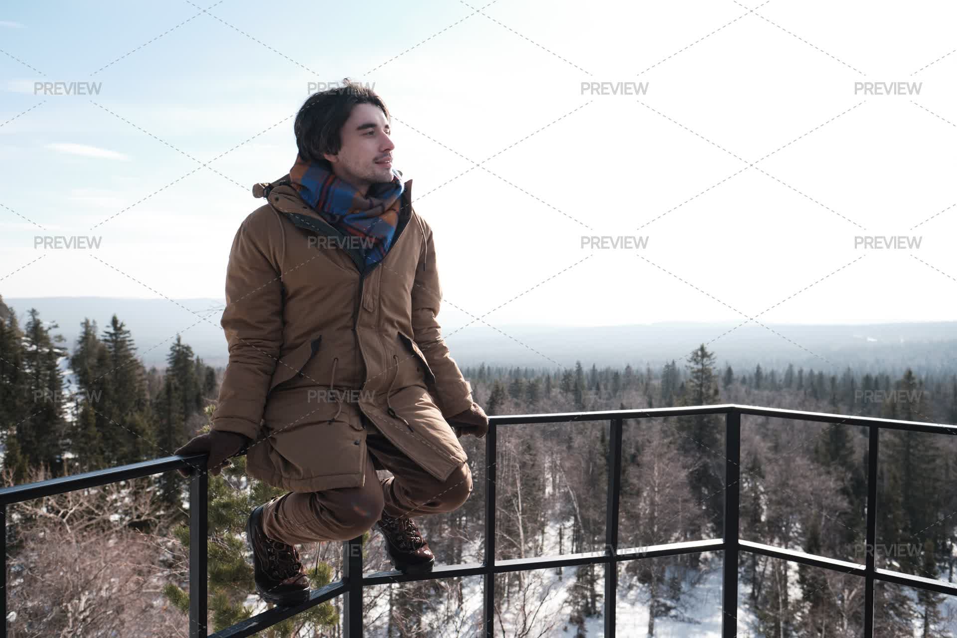 Someone Sitting Railing Man Sitting On Railing At Viewing Platform - Stock Photos | Motion Array
