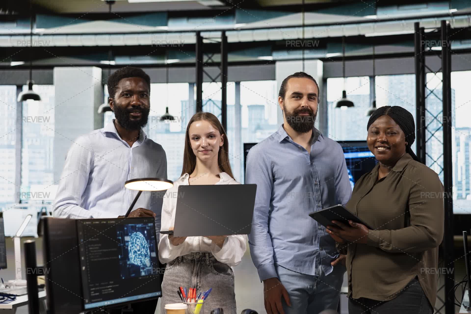 Portrait Of Happy Software Development Team In Office Using AI by ...
