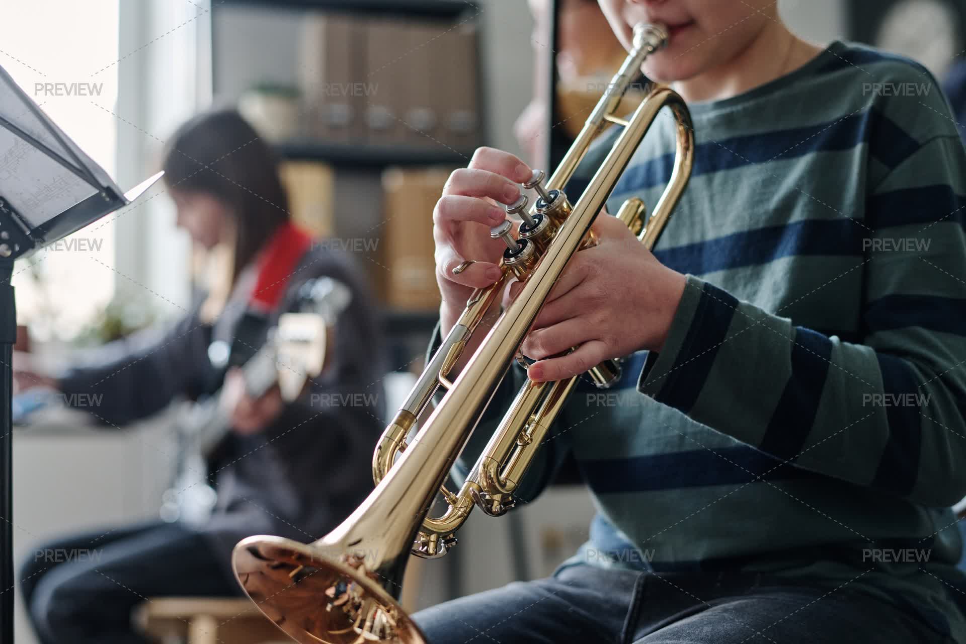Trumpet Array Boy Playing Trumpet - Stock Photos | Motion Array