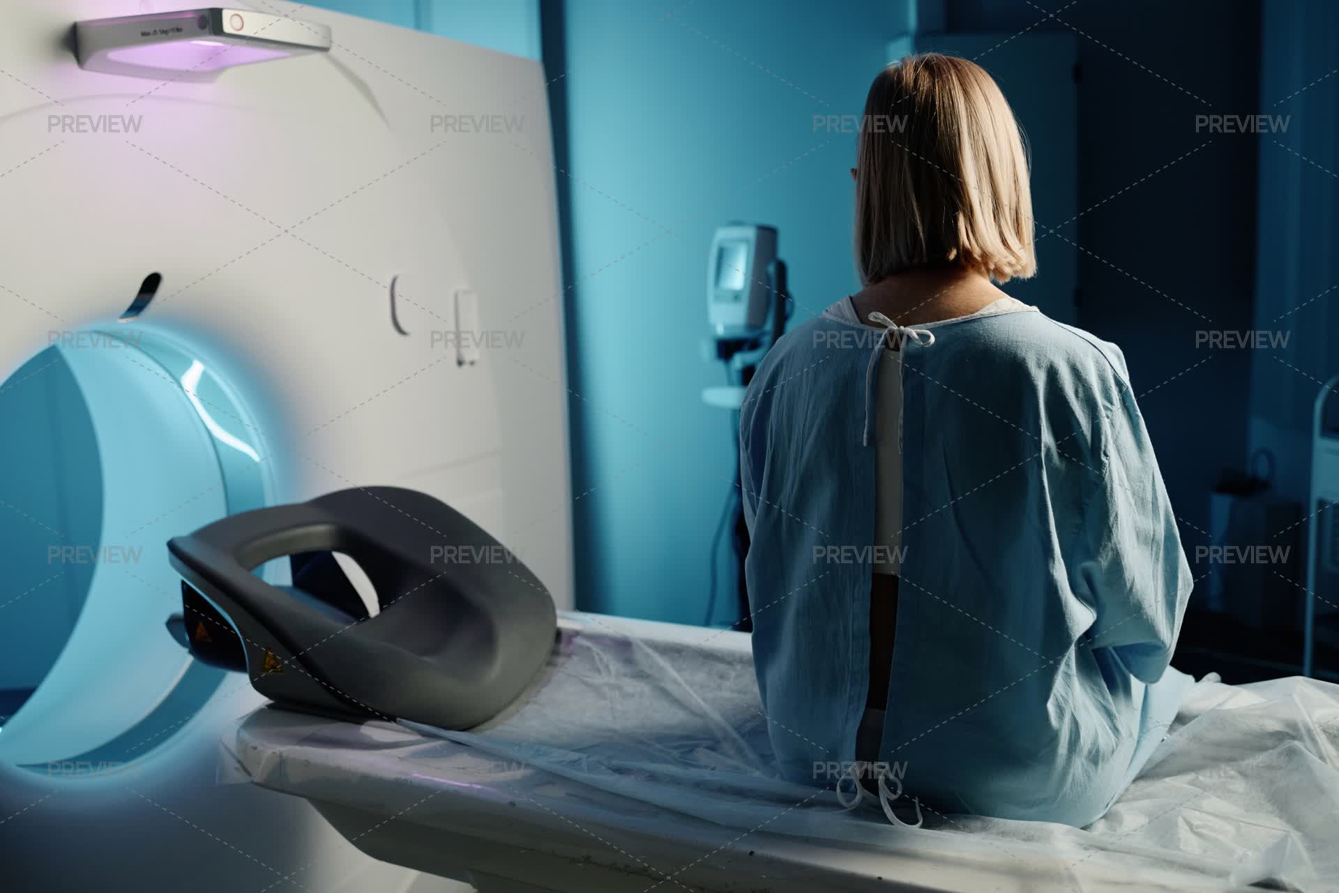Women Scanner Back View Of Woman Sitting On CT Scanner Bed by AnnaStills - Stock ...