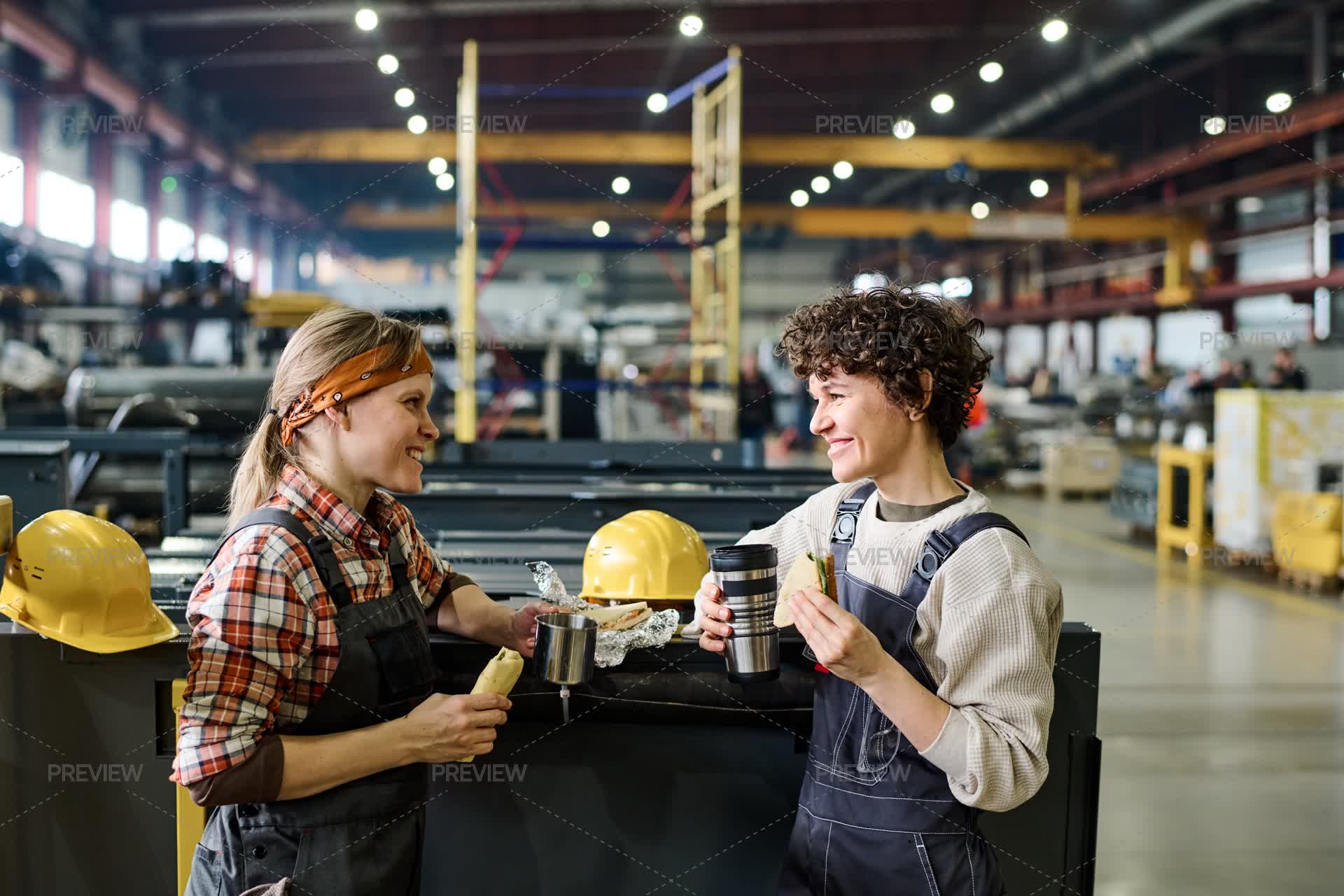 Pretty Engineers Female Engineers Having Sandwiches And Hot Tea In Workshop Of ...