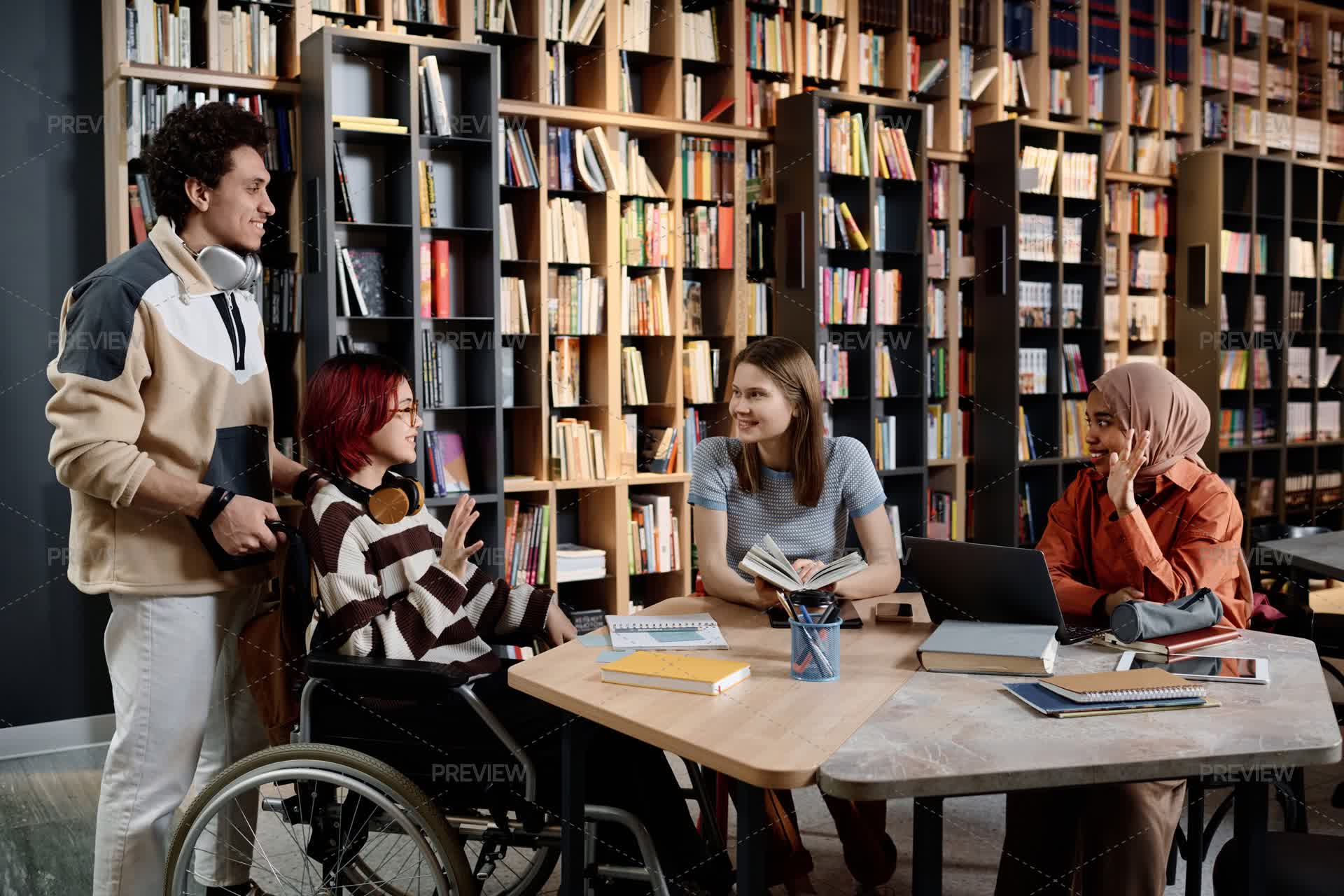 Group Of Diverse Students Gathering In Library - Stock Photos | Motion ...
