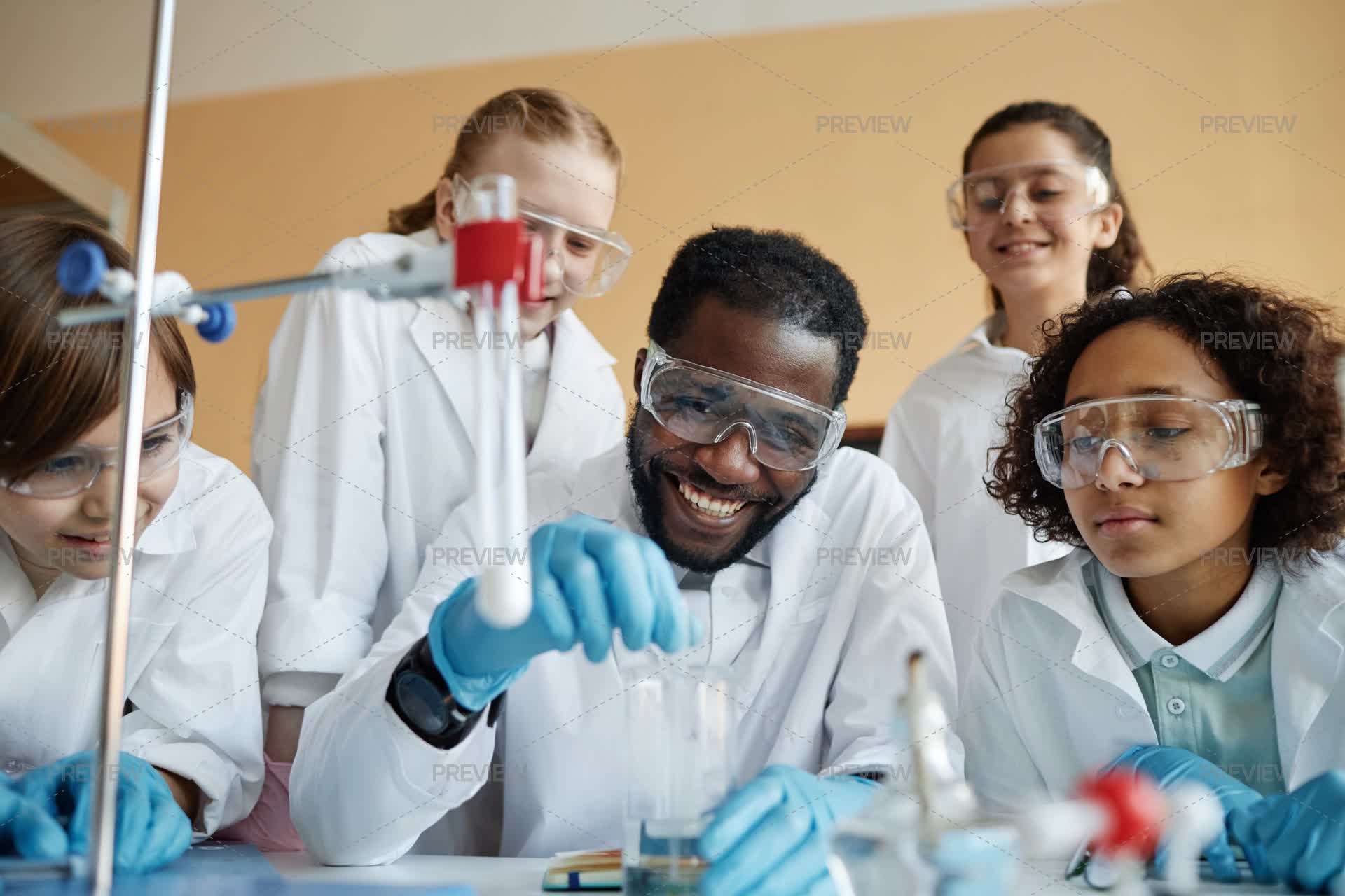 Dooing Lab Teacher And Kids Doing Lab Experiment by AnnaStills - Stock Photos ...