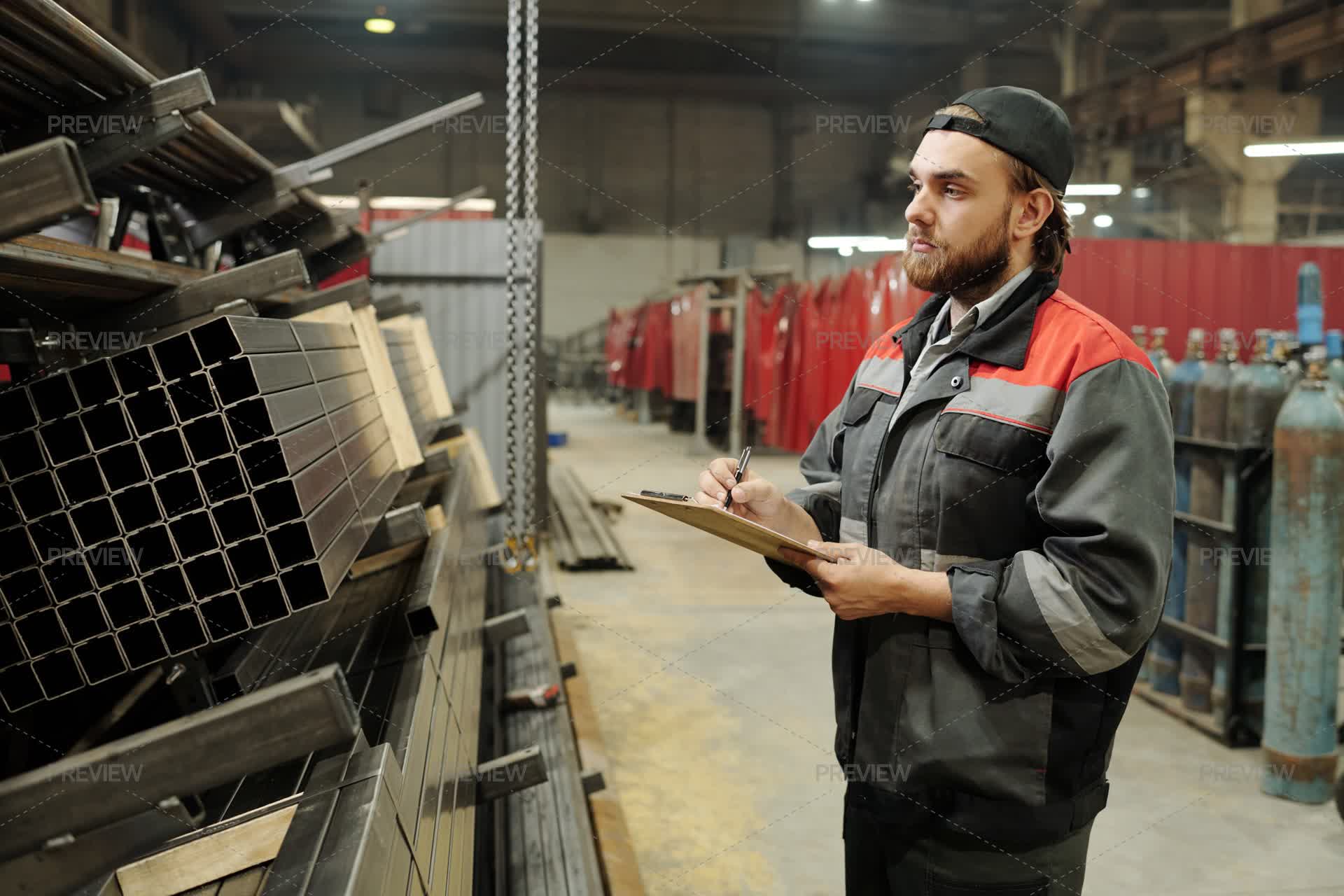 Engineer In Uniform Writing Down Names Of Work Materials - Stock Photos ...