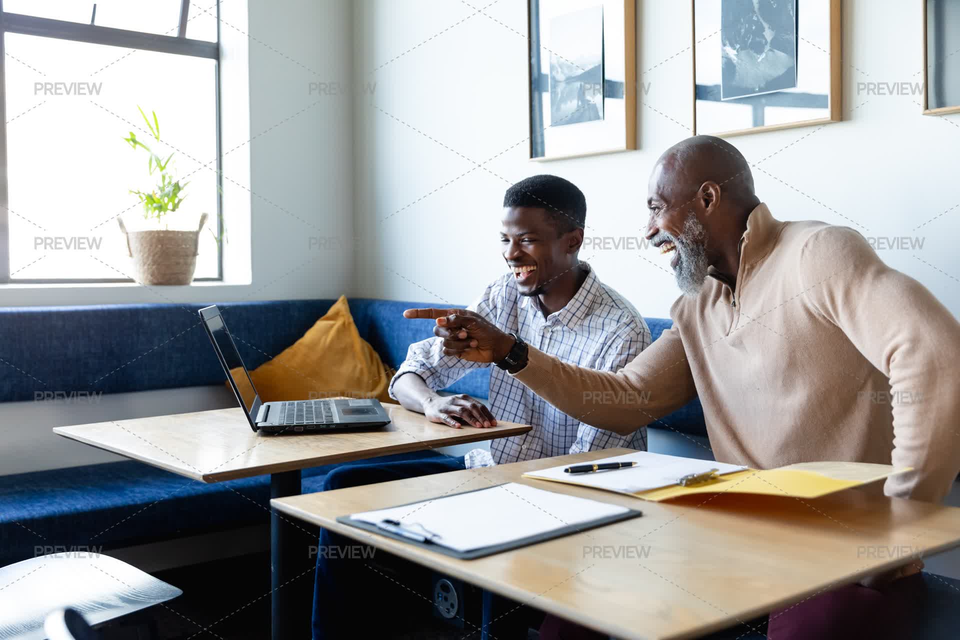 Two Guys Working Two Men Working Together At Laptop - Stock Photos | Motion Array