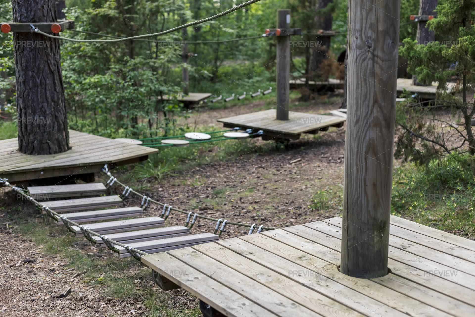 Wooden Platforms And Rope Bridges Create An Engaging Climbing ...