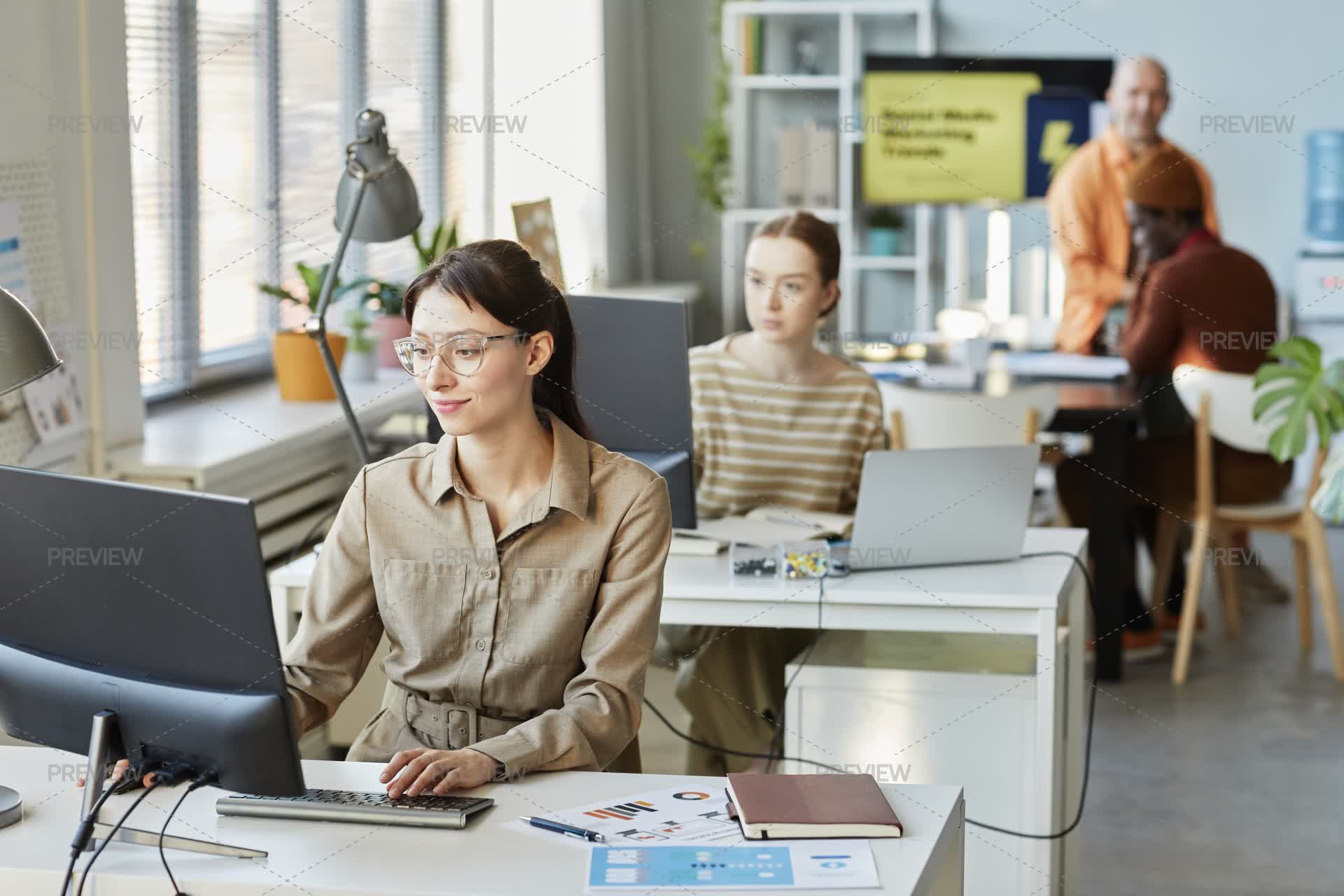 Computer Use In Workplace Businesswoman Using Computer At Workplace - Stock Photos | Motion Array