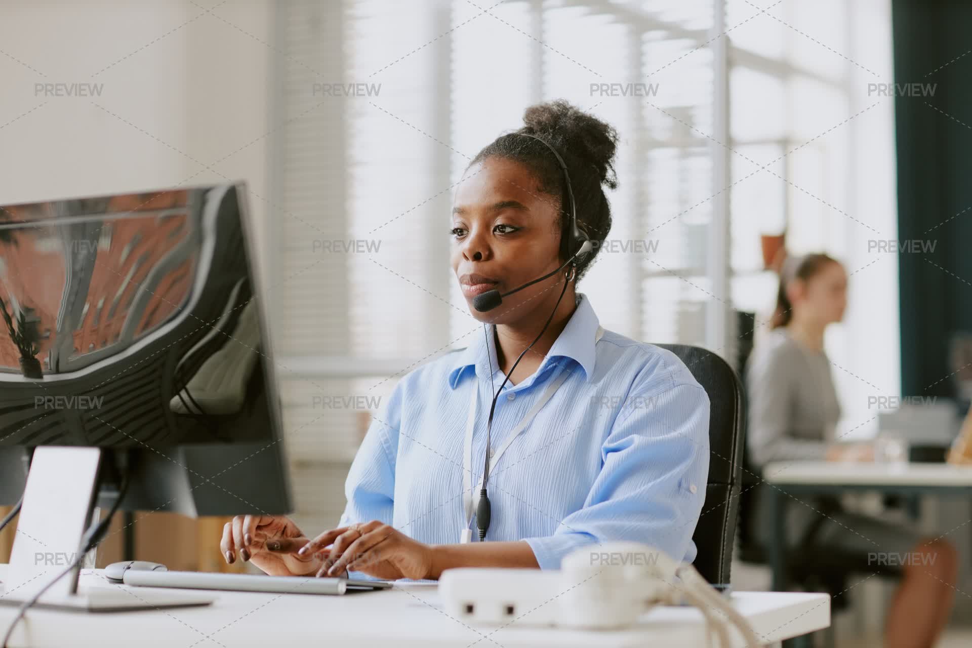 Office Worker Using Computer In Modern Office by AnnaStills - Stock ...