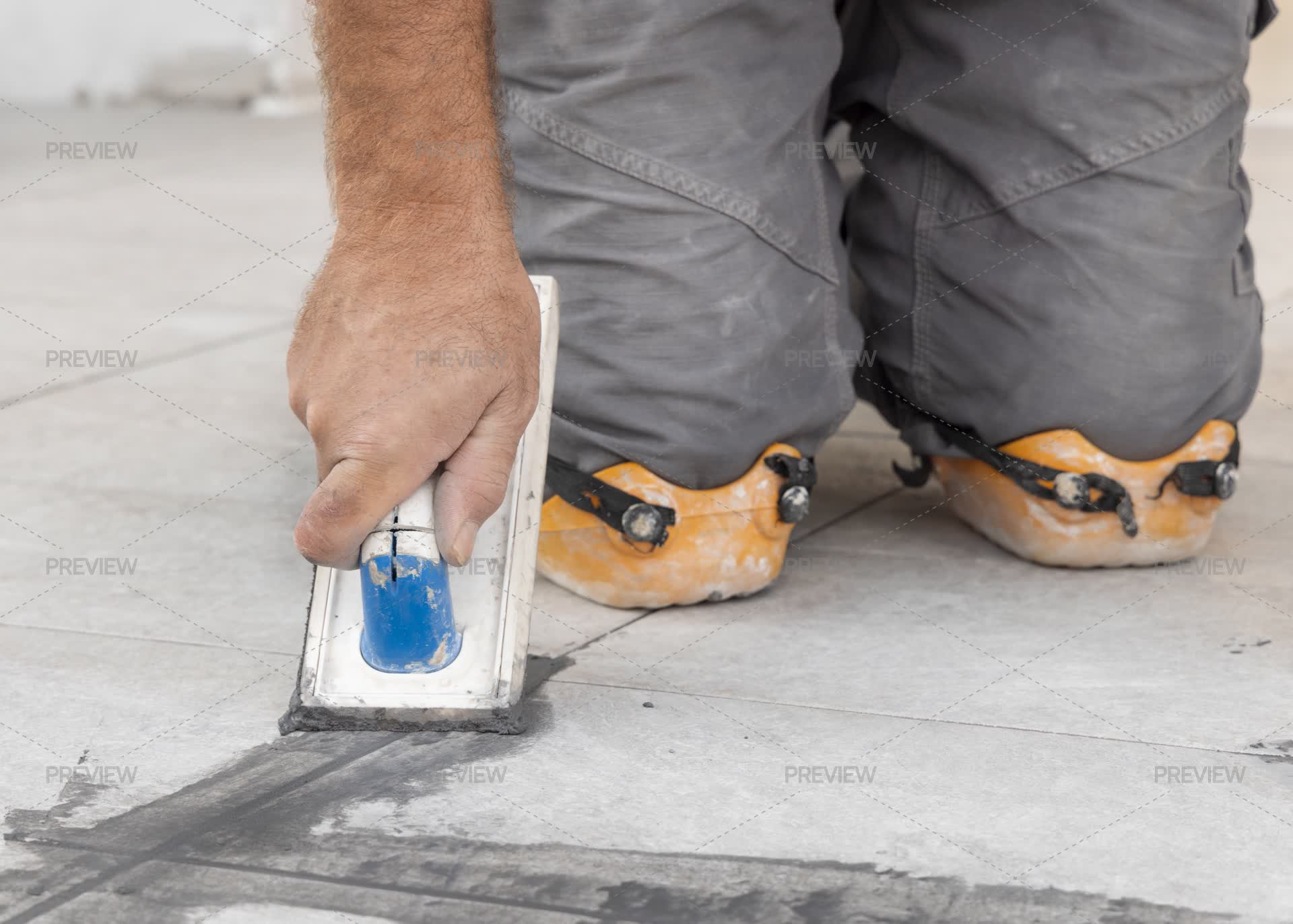 Array Grout Craftsman Filling Tile Joints With Grout Using A Float, Hand Closeup ...