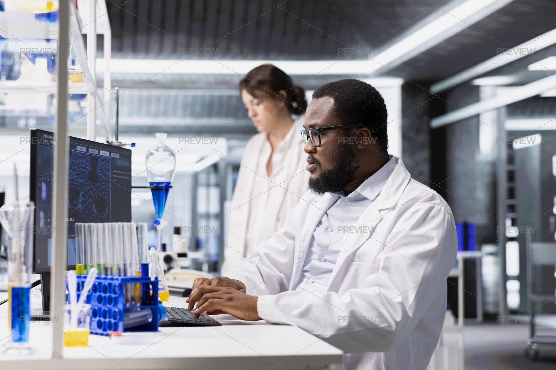 Researcher Using Computer Application For DNA Data Analysis In ...