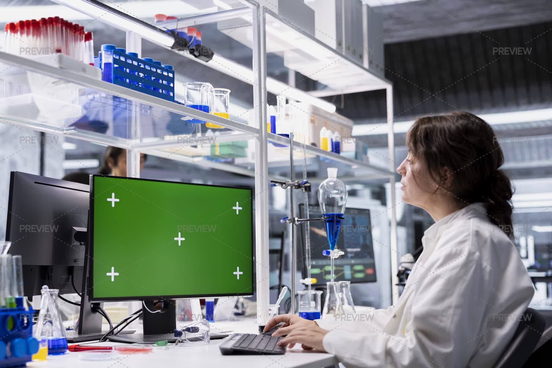 Lab Tech Computer Screen Lab Technician Looking At 3D Molecular Model On Green Screen Computer ...