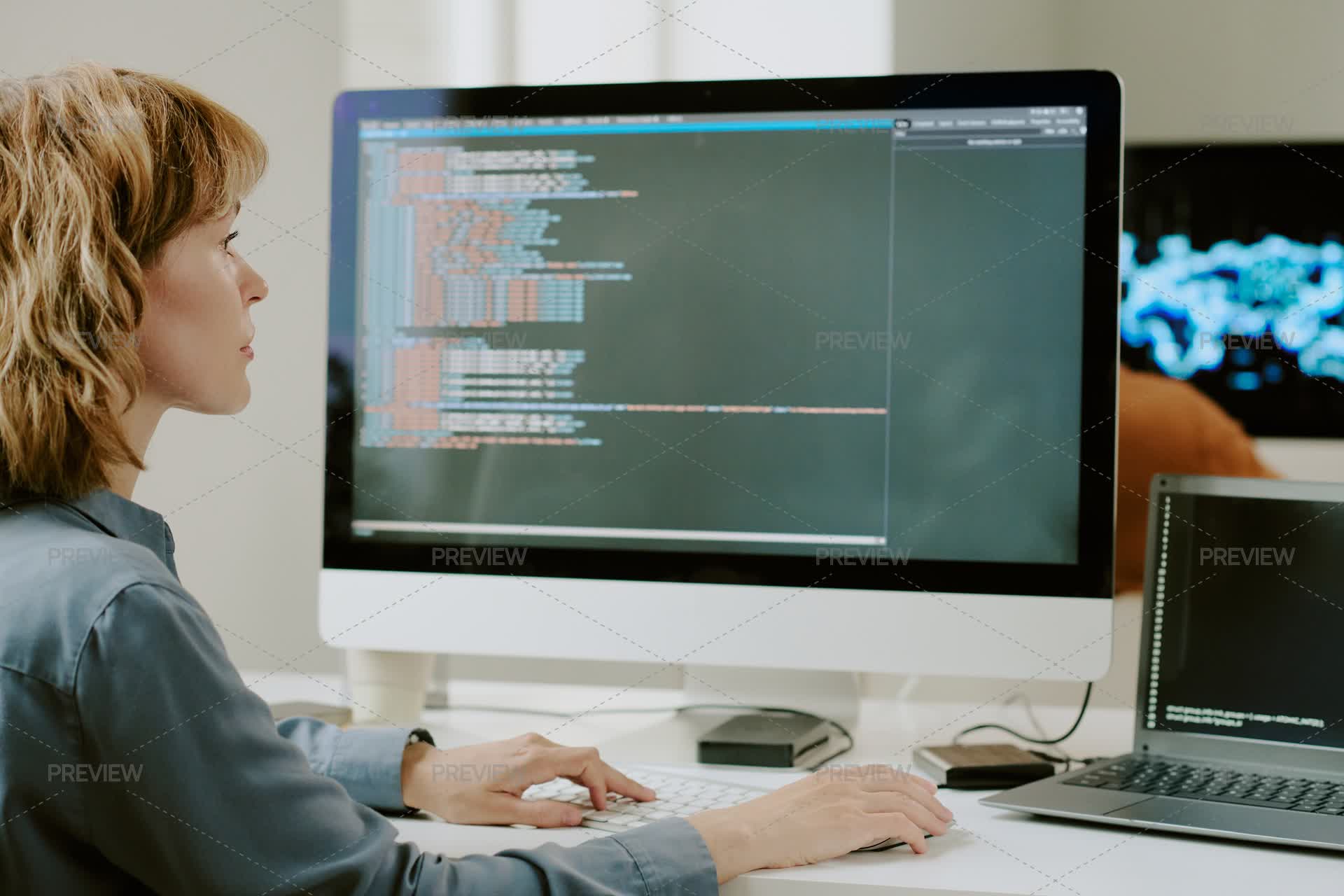 Female Developer Coding On Desktop Computer - Stock Photos | Motion Array