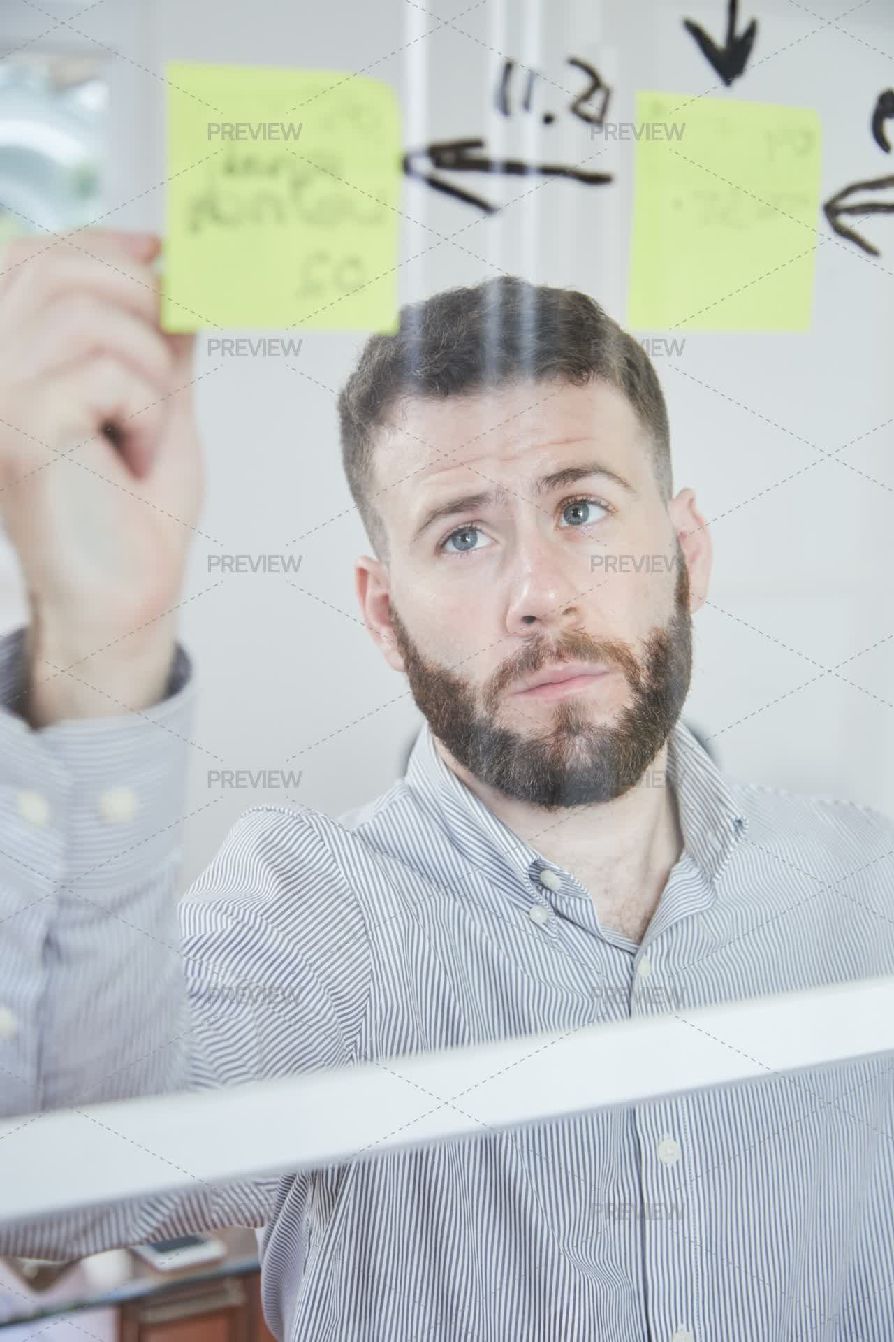 Reminder Man Man Writing A Reminder On Notes by DragonImages - Stock Photos | Motion ...